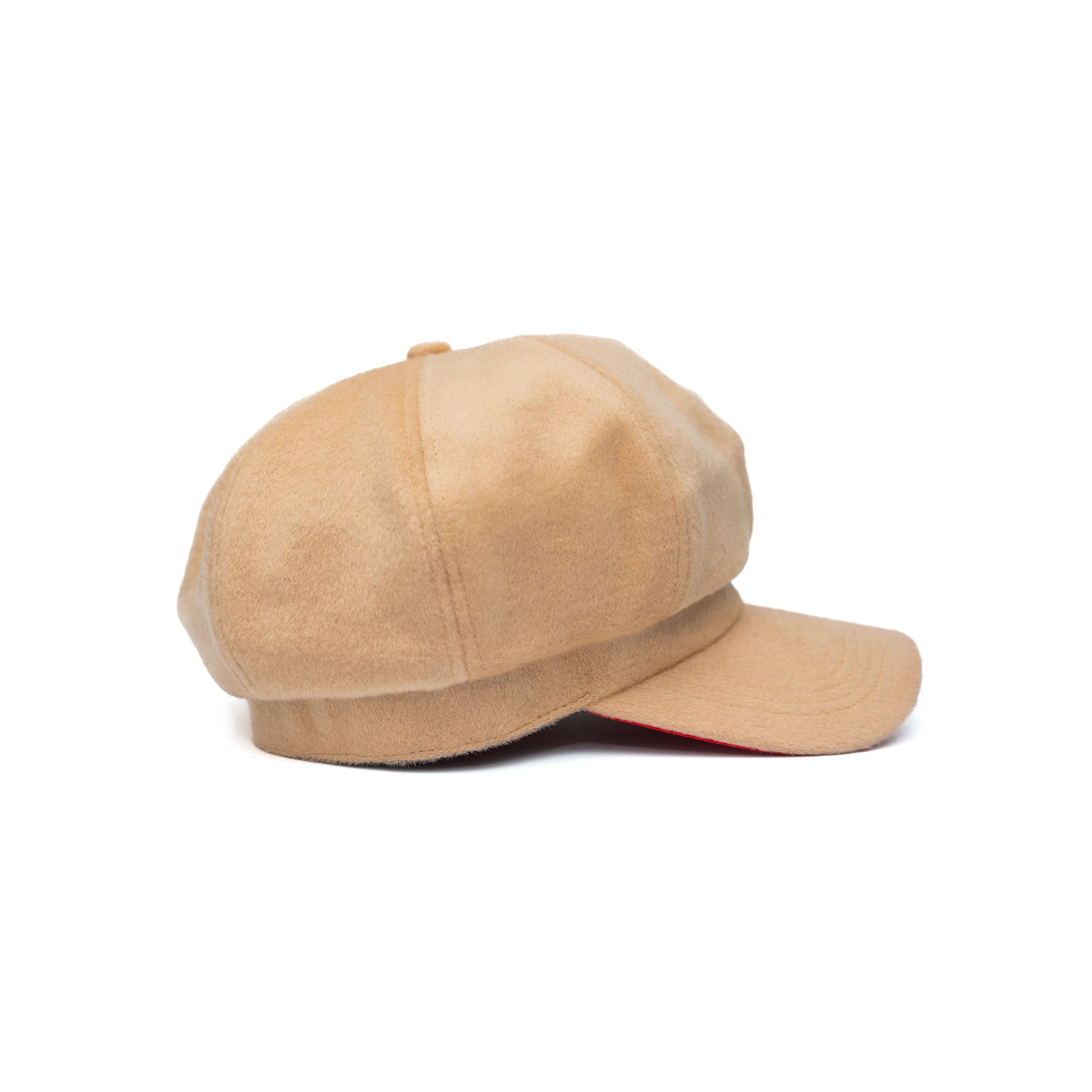 A beige colored wool hat with a cotton twill visor, featuring a satin padded sweatband and a signature logo pin.