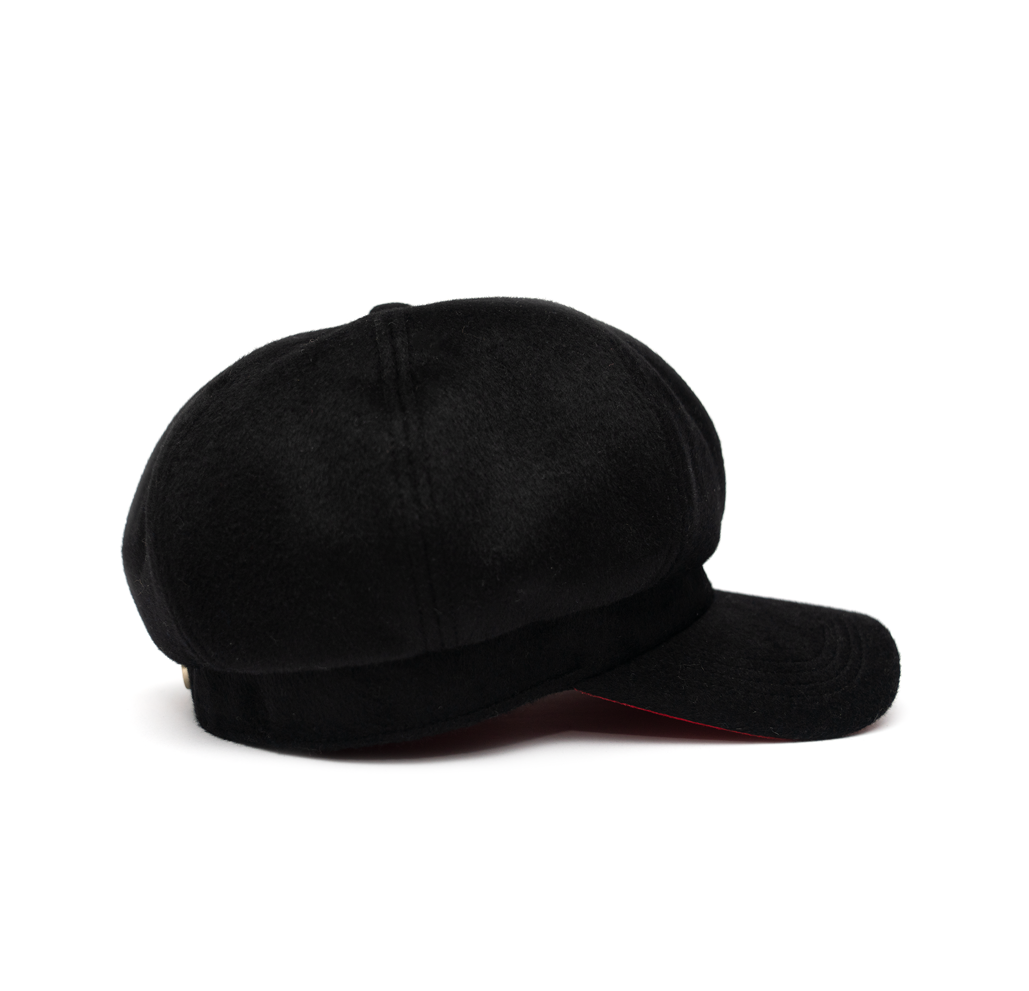 A black color cap with a visor, made of wool with satin lining and a logo pin on the front.