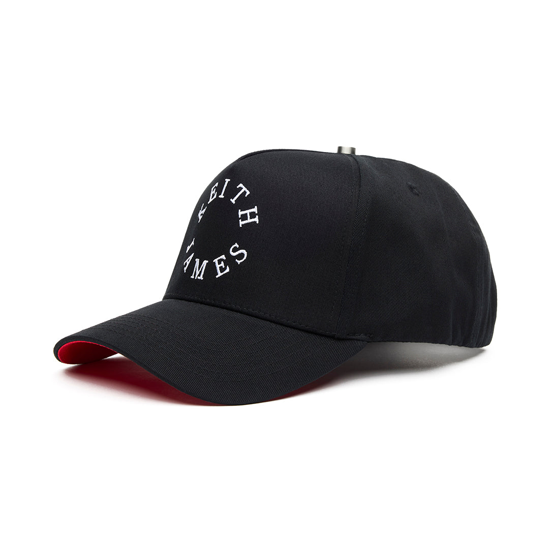A black 5 panel baseball cap with an adjustable band, featuring the embroidered logo 'KEITH JAMES' on the front.