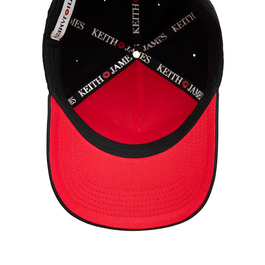 A black 5 panel baseball cap with an adjustable band, featuring the embroidered logo 'KEITH JAMES' on the front.