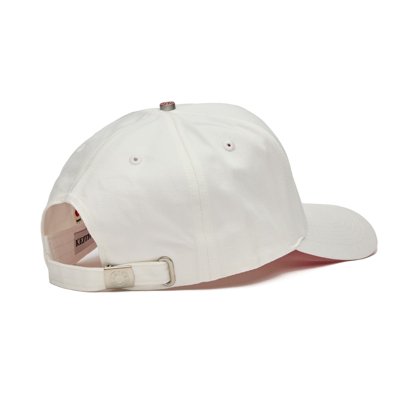 White baseball cap with red interior on a white background