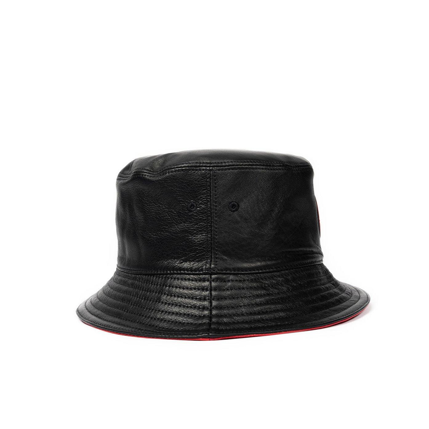 A jet black leather bucket hat with a red stamped leather logo circle in the center.