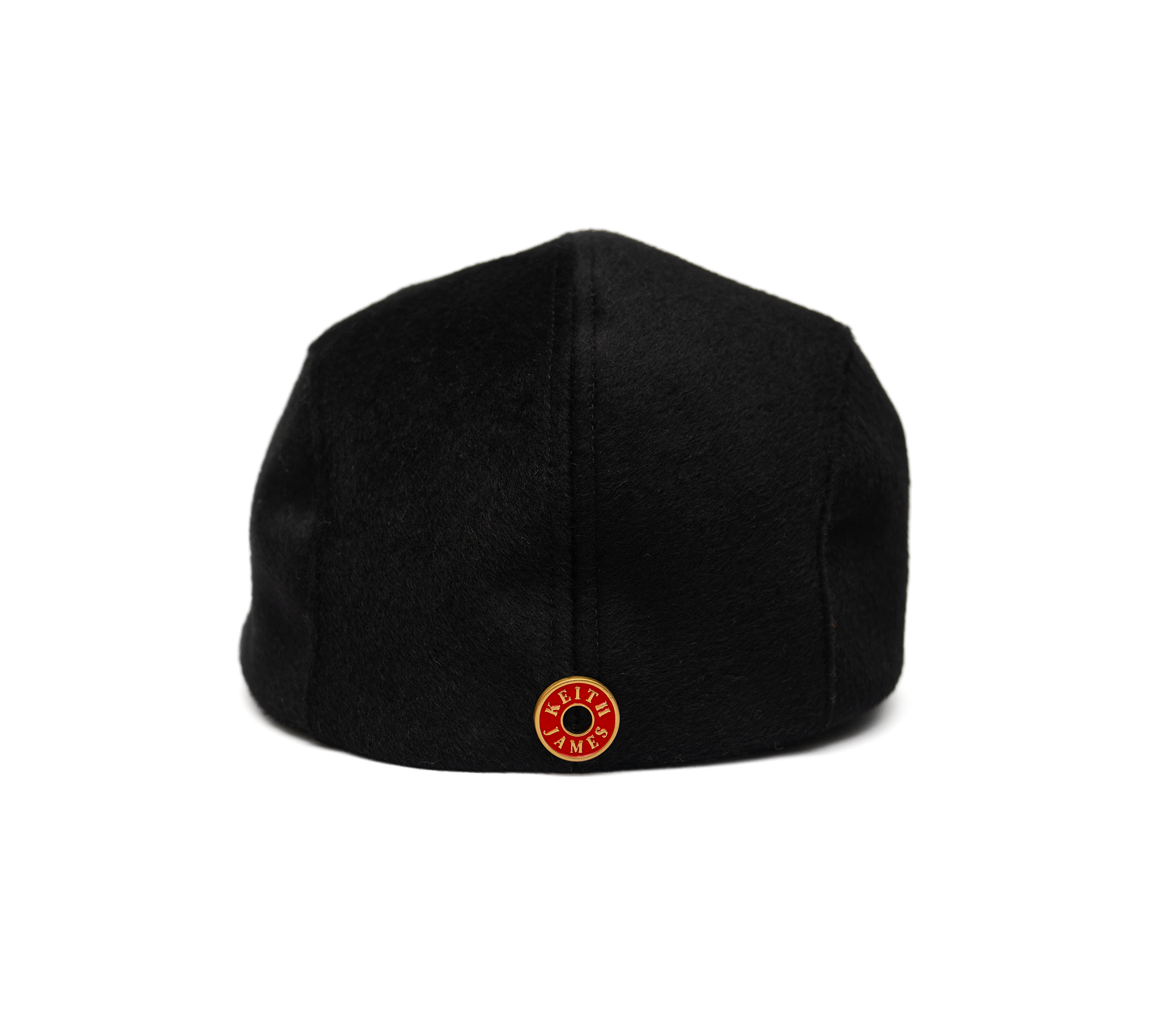 A black flat cap made of wool with a satin lining and gold hardware.