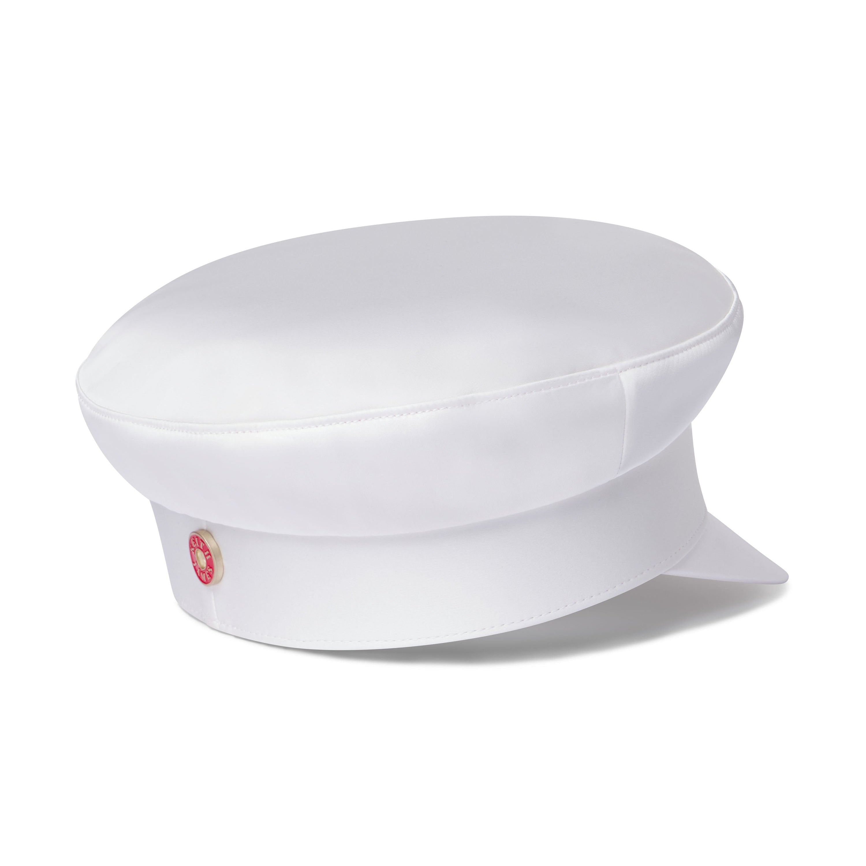 A white structured sailor cap with a flat brim, featuring a signature red satin lining visible at the base and branded with a small red logo. It has brushed gold hardware at the back band and a soft curved visor.