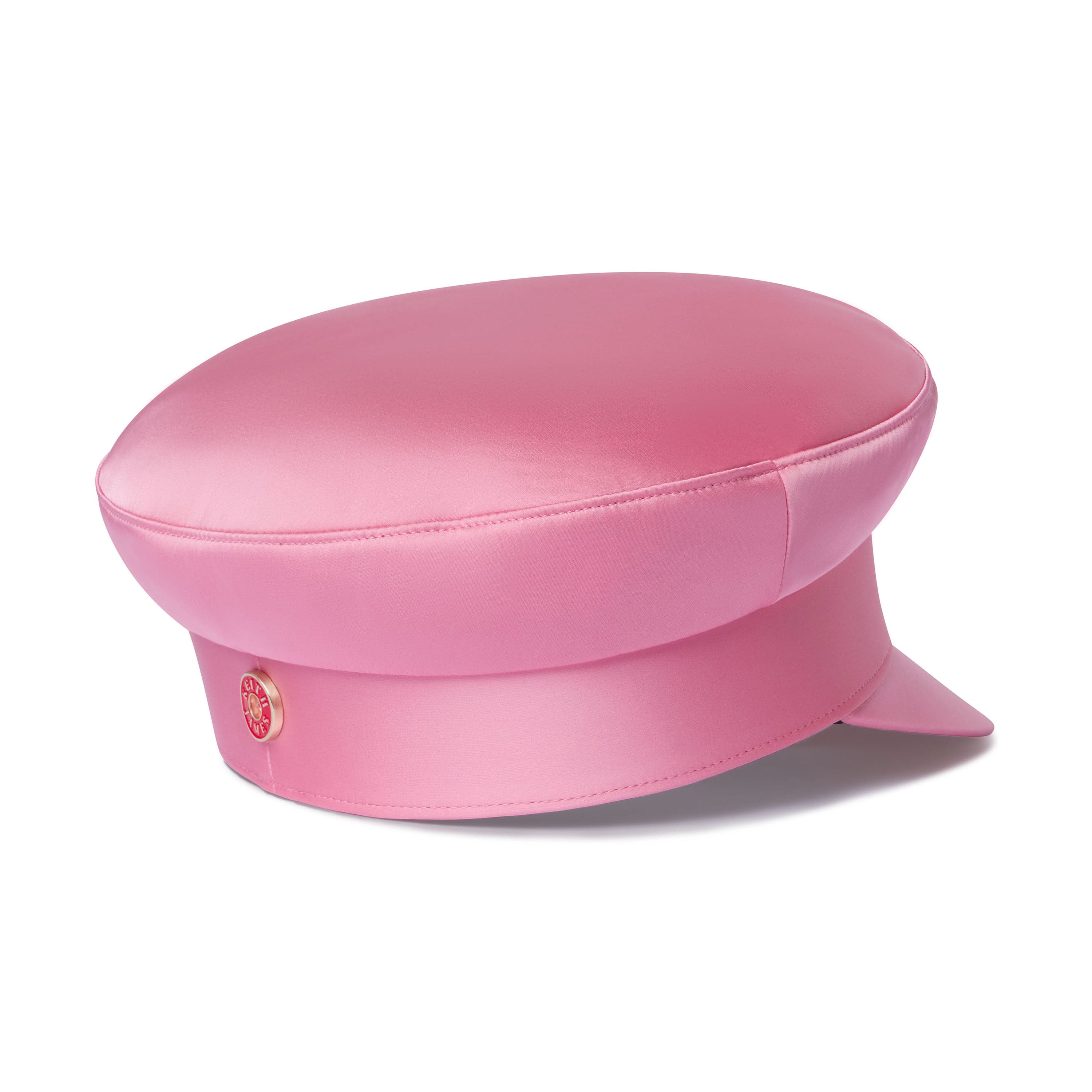 A soft pink, modern structured sailor cap with a signature red satin lining, brushed gold hardware at the back band, a soft curved visor, and a branded sweatband.