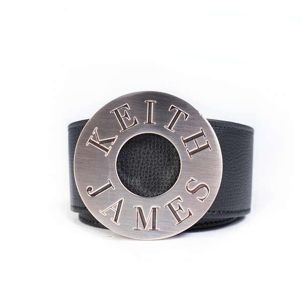 A silver palladium-plated reversible leather buckle with the brand name 'Knotus' inscribed on it.