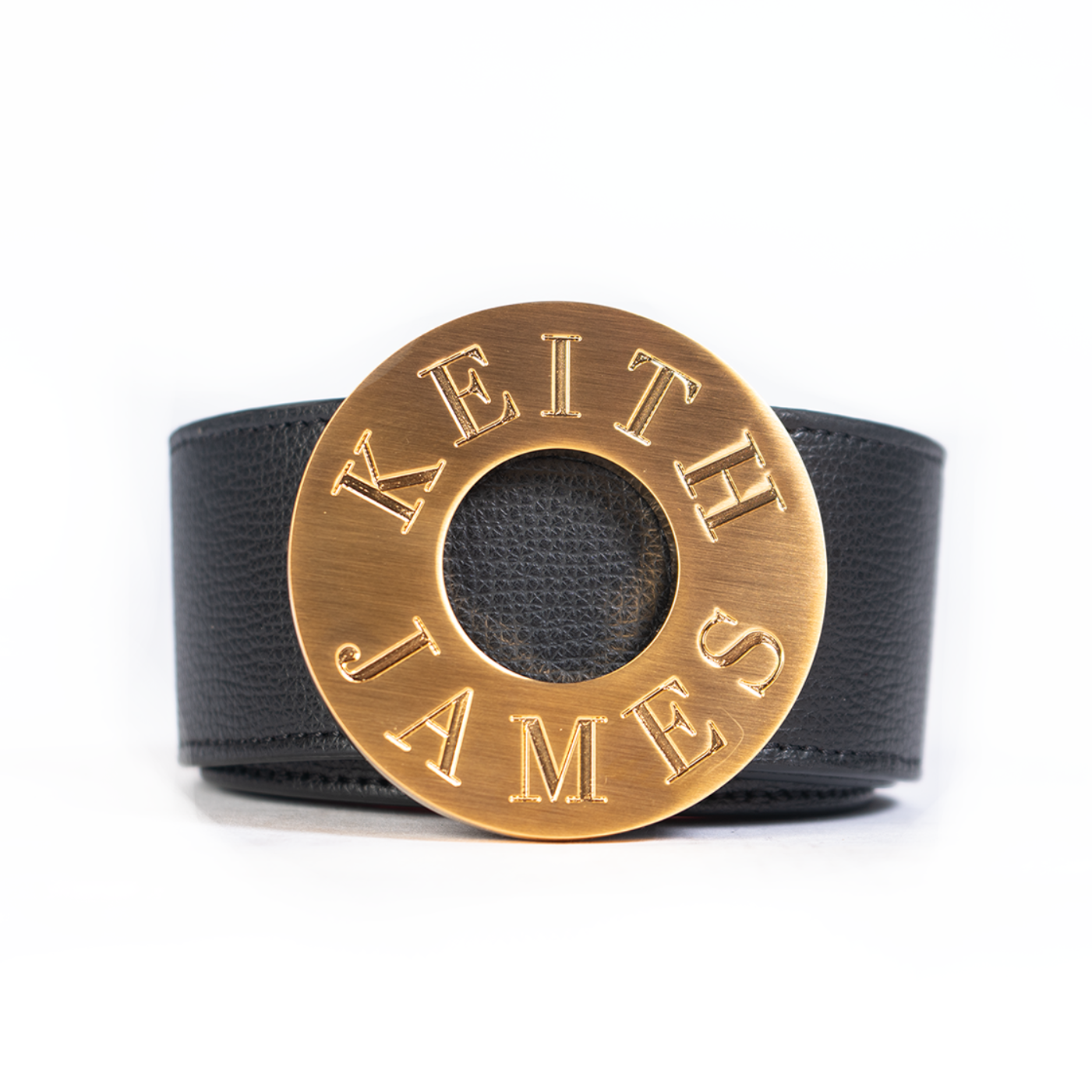 A black leather belt with a gold-plated buckle featuring the text 'KEITH LAMM'.