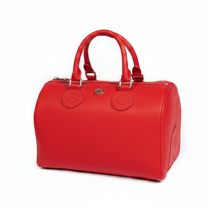 A rose red handbag with a structured design, featuring two handles and a front zipper closure.