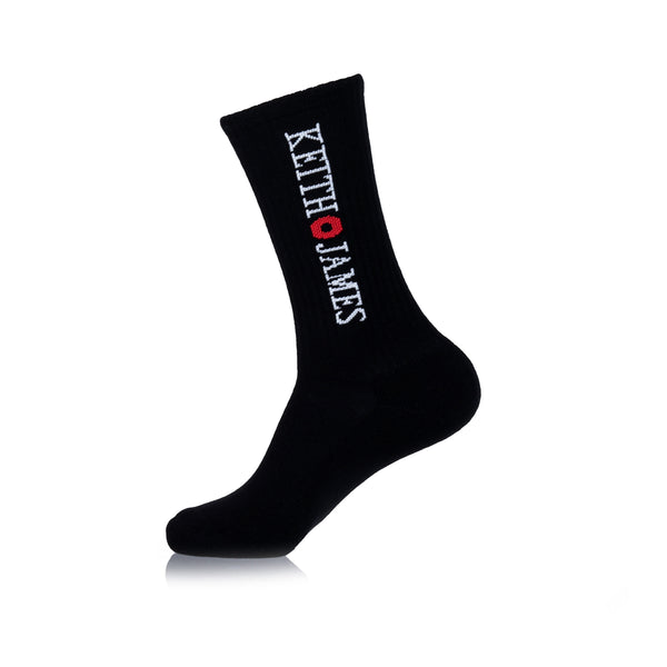A black crew-length sock with text 'KEITH JAMES' printed on the side.