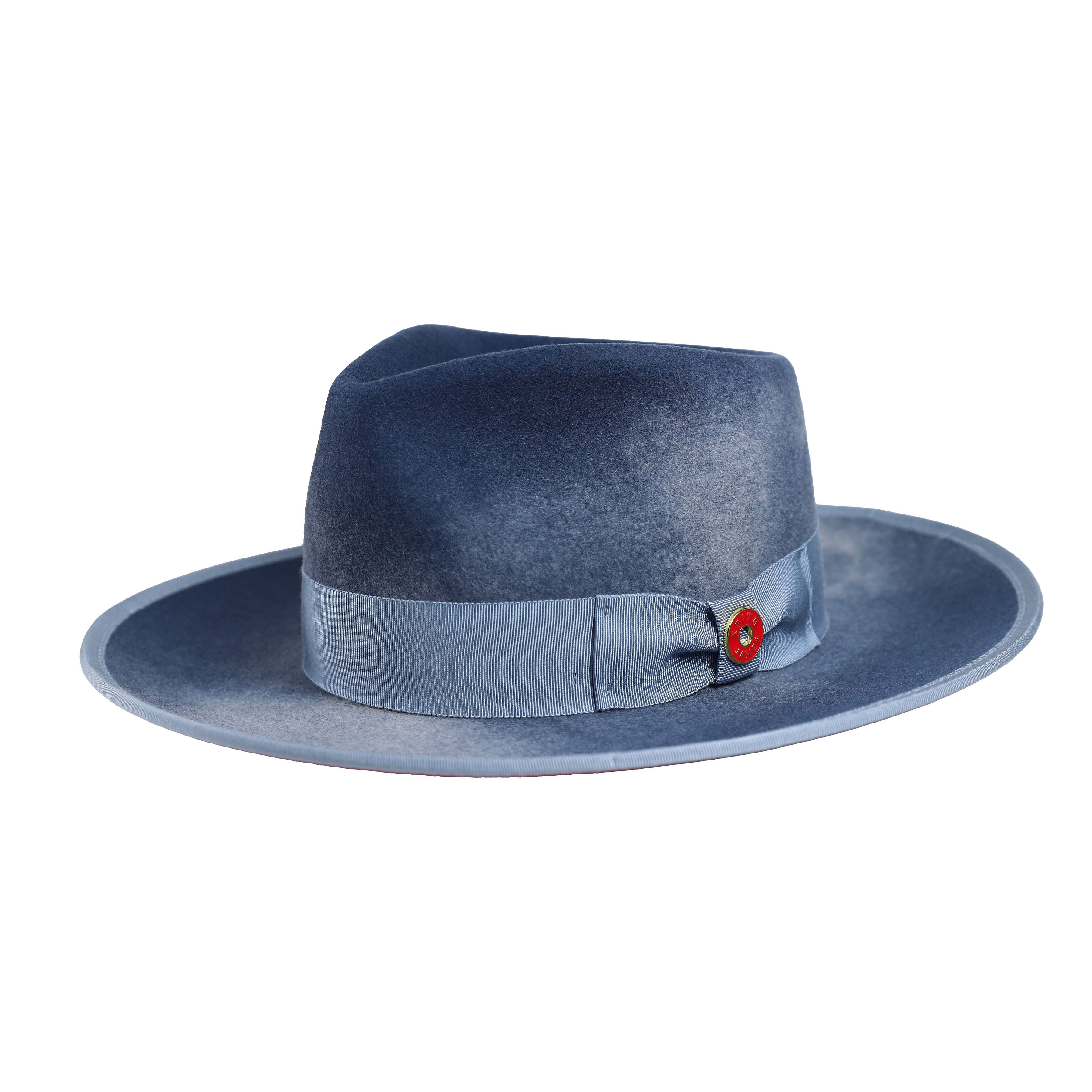 A swirl blue hat with a wide brim and a red bottom, featuring a classic ribbon and bow with a pin, made in the USA.