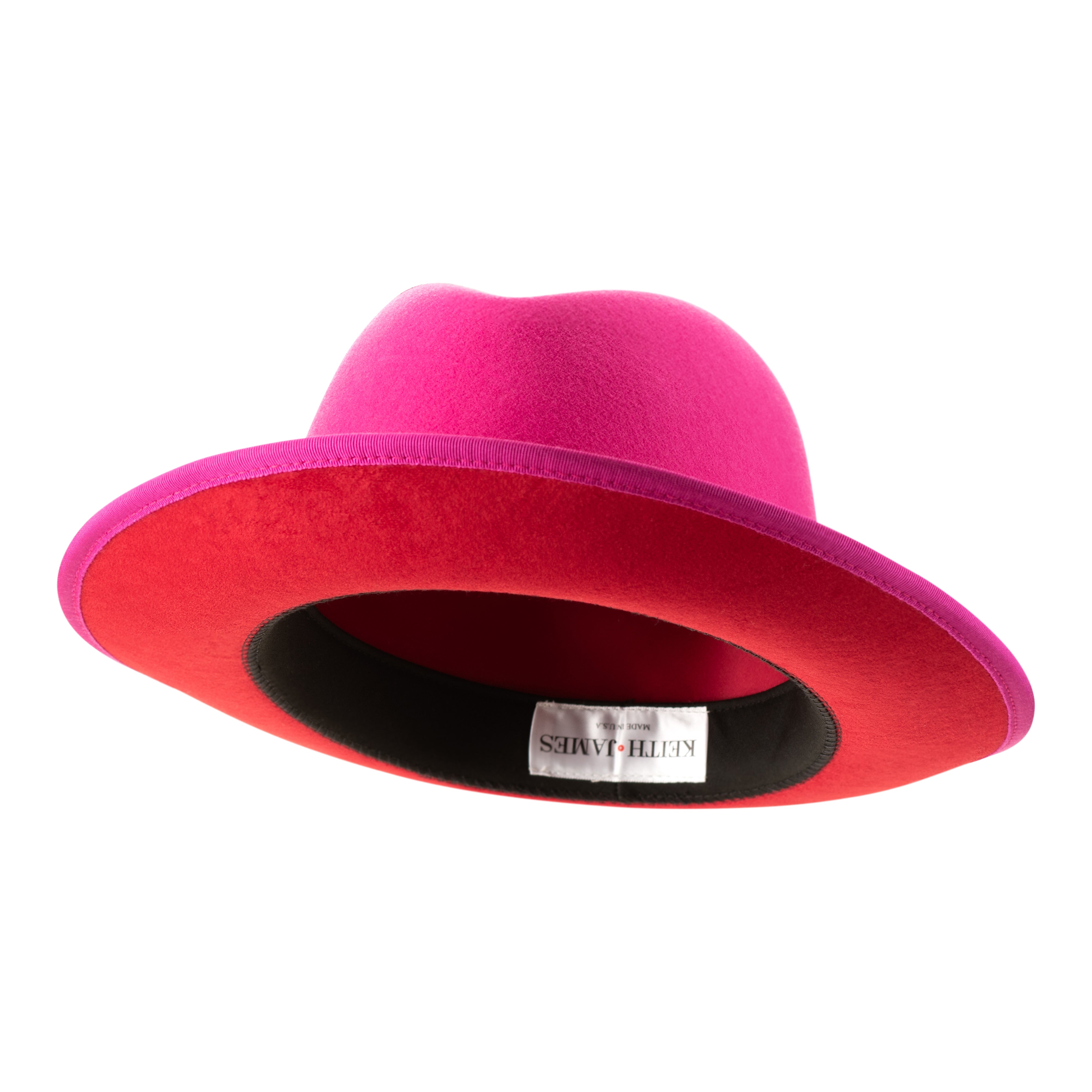 A hot pink classic center-creased fedora with a 2.5 inch curved brim and a signature logo pin on the side.