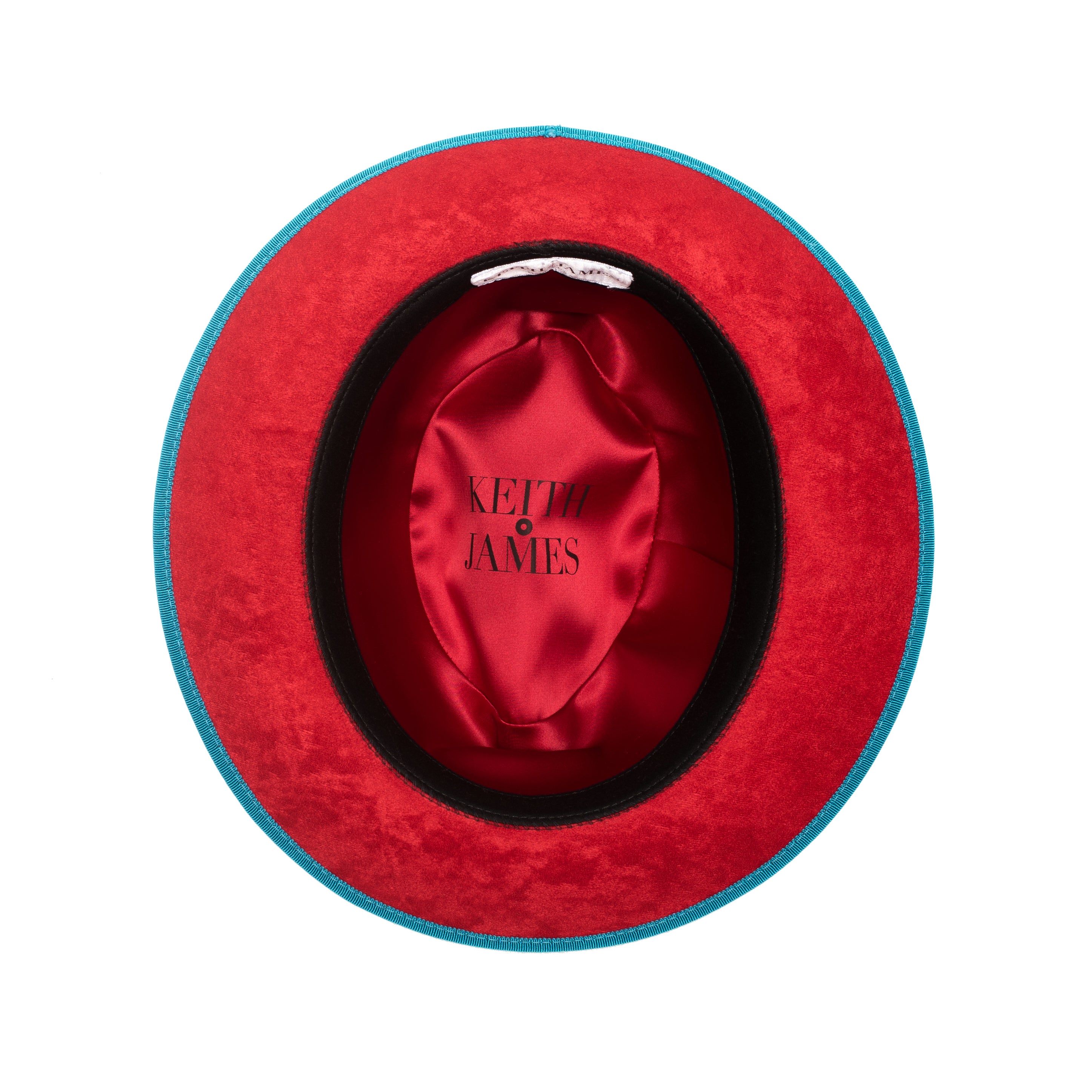 A classic center-creased fedora hat in ocean blue color with a red bottom brim and a signature logo pin.