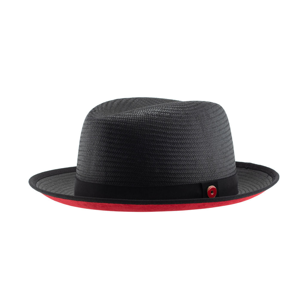 A Jet Black straw fedora with a red under brim and a signature logo pin on the side.