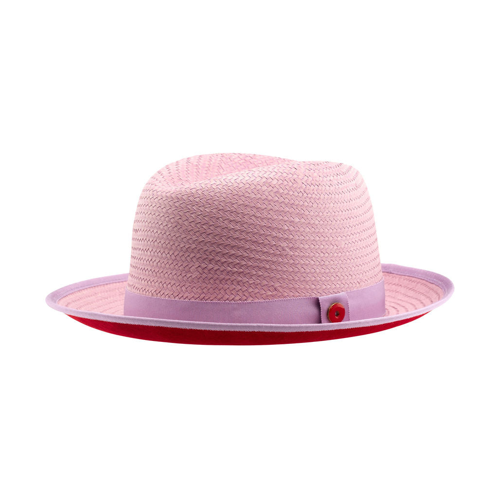 A purple classic center-creased fedora with a 2.5 inch curved brim, featuring a red bottom brim and a signature logo pin.