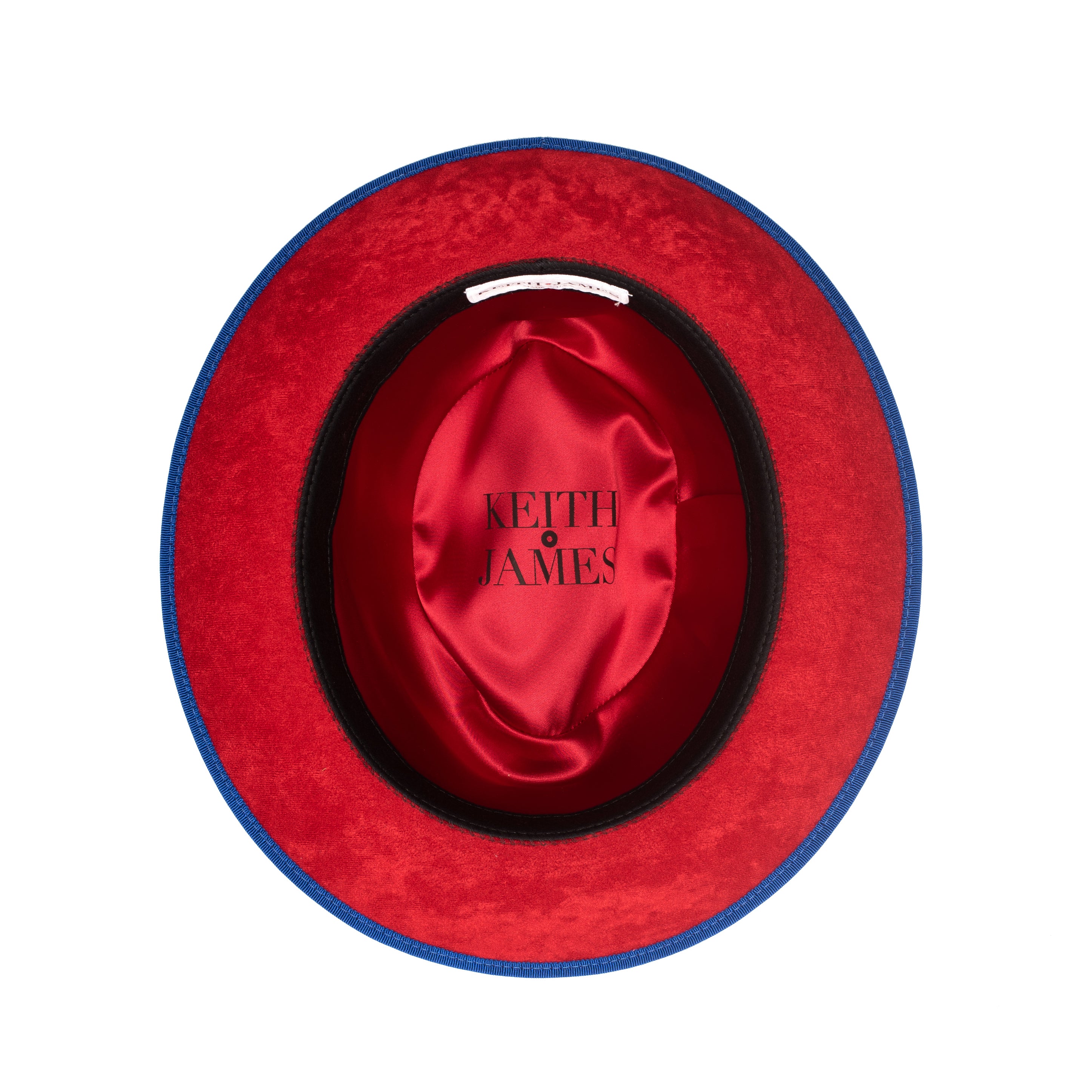 A blue fedora hat with a red bottom brim and a signature logo pin.