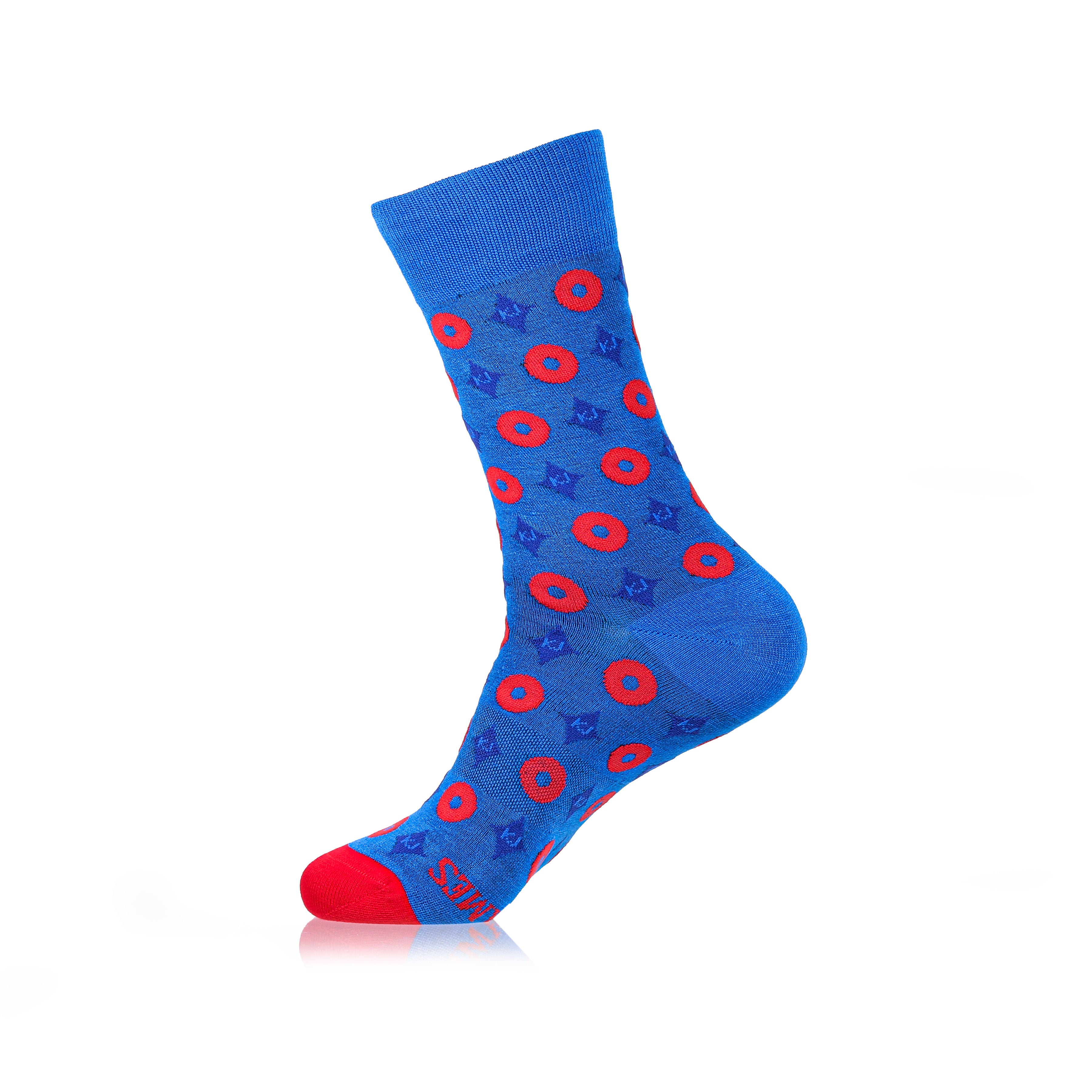 A pair of blue crew-length socks with a geometric pattern and red accents at the heel and toe.