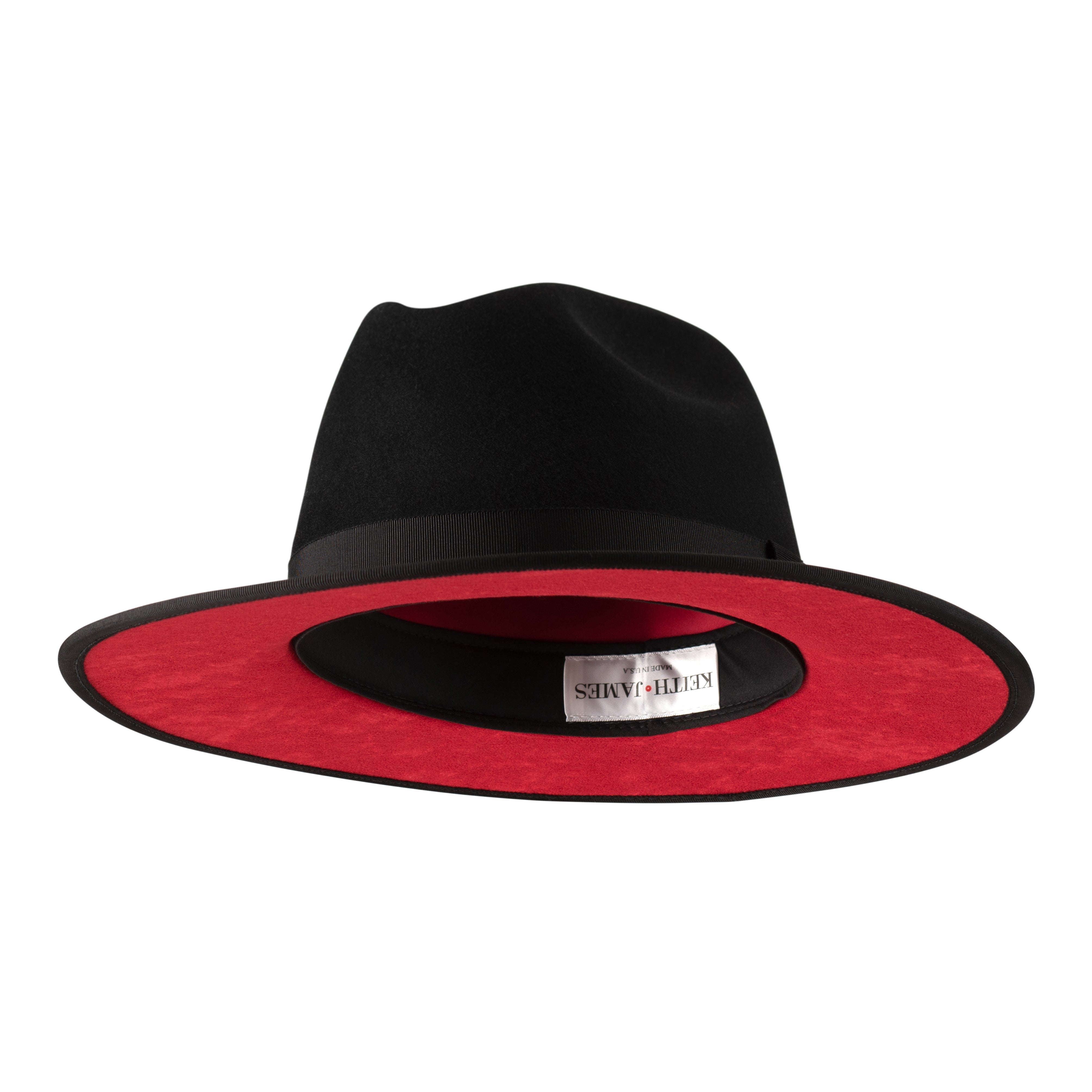 A jet black fedora hat with a pinched crown, flat brim, and bound edge. It includes a classic ribbon trim, a signature logo pin, and a red bottom brim.