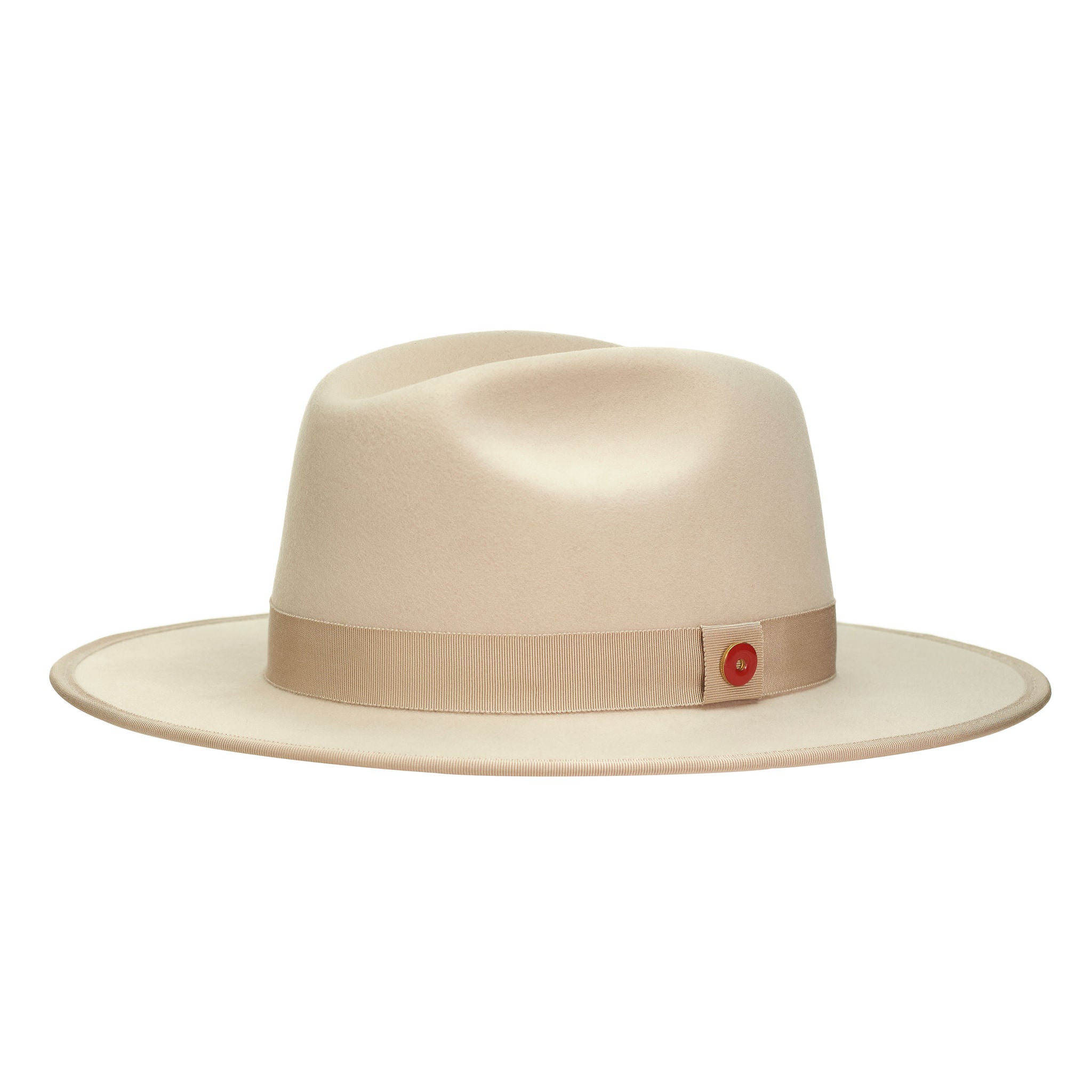 A sandy beige fedora hat with a flat brim and classic ribbon trim, featuring a signature logo pin and red bottom brim.