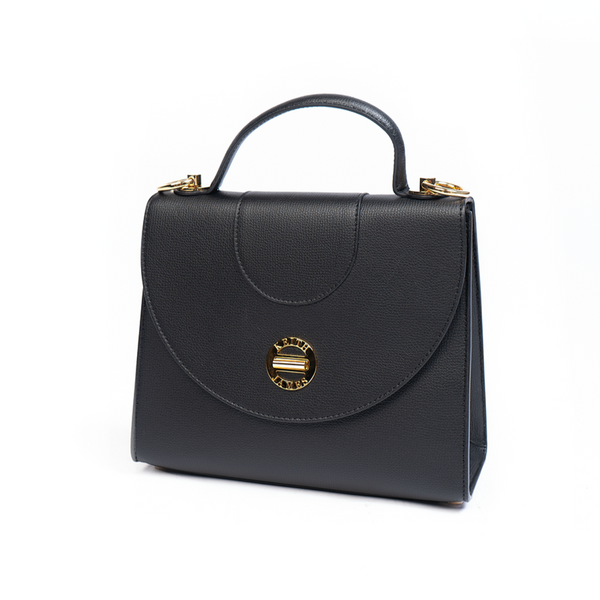 A jet black top handle handbag with a leather exterior, a visible brand logo on the front, and a gold-tone hardware.