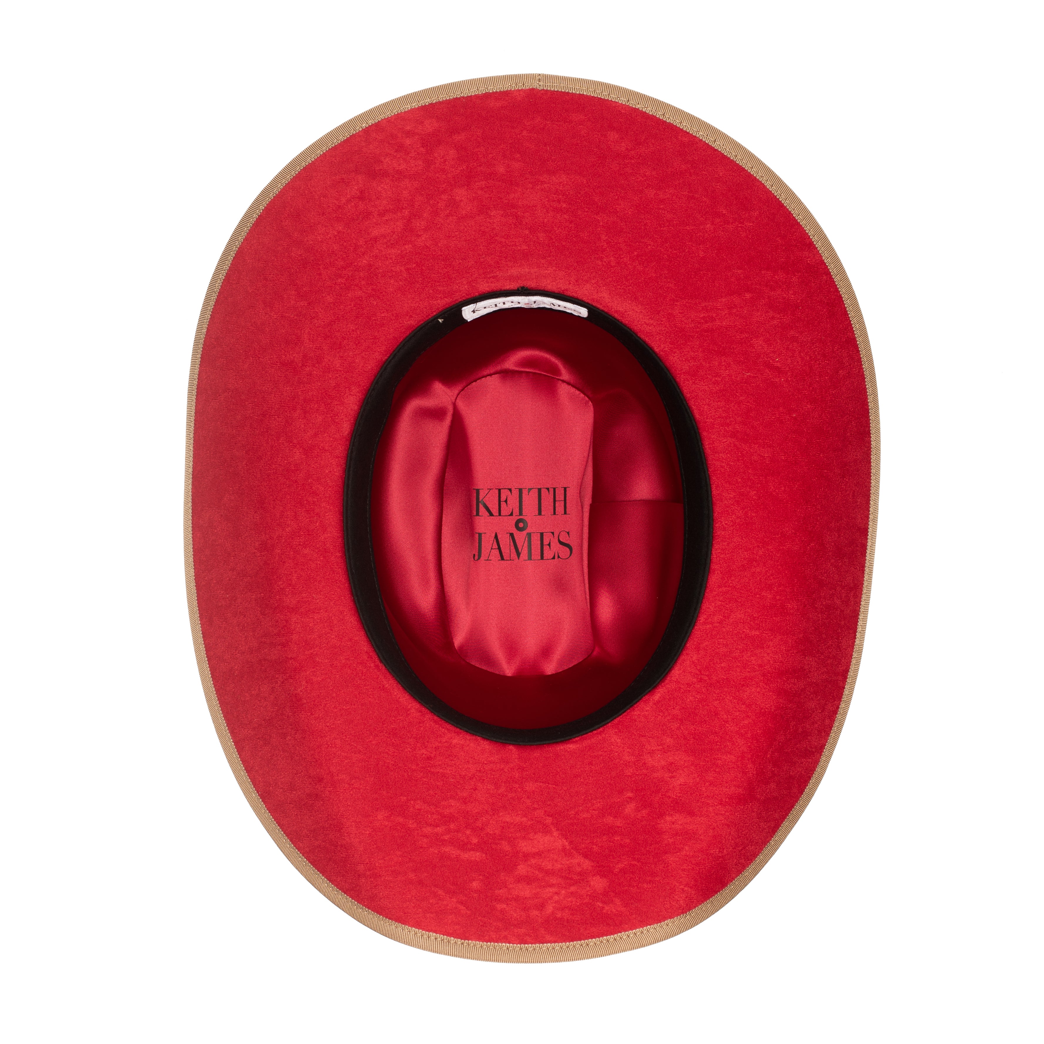 A golden honey colored cowboy hat with a red suede under brim and a hat pin.