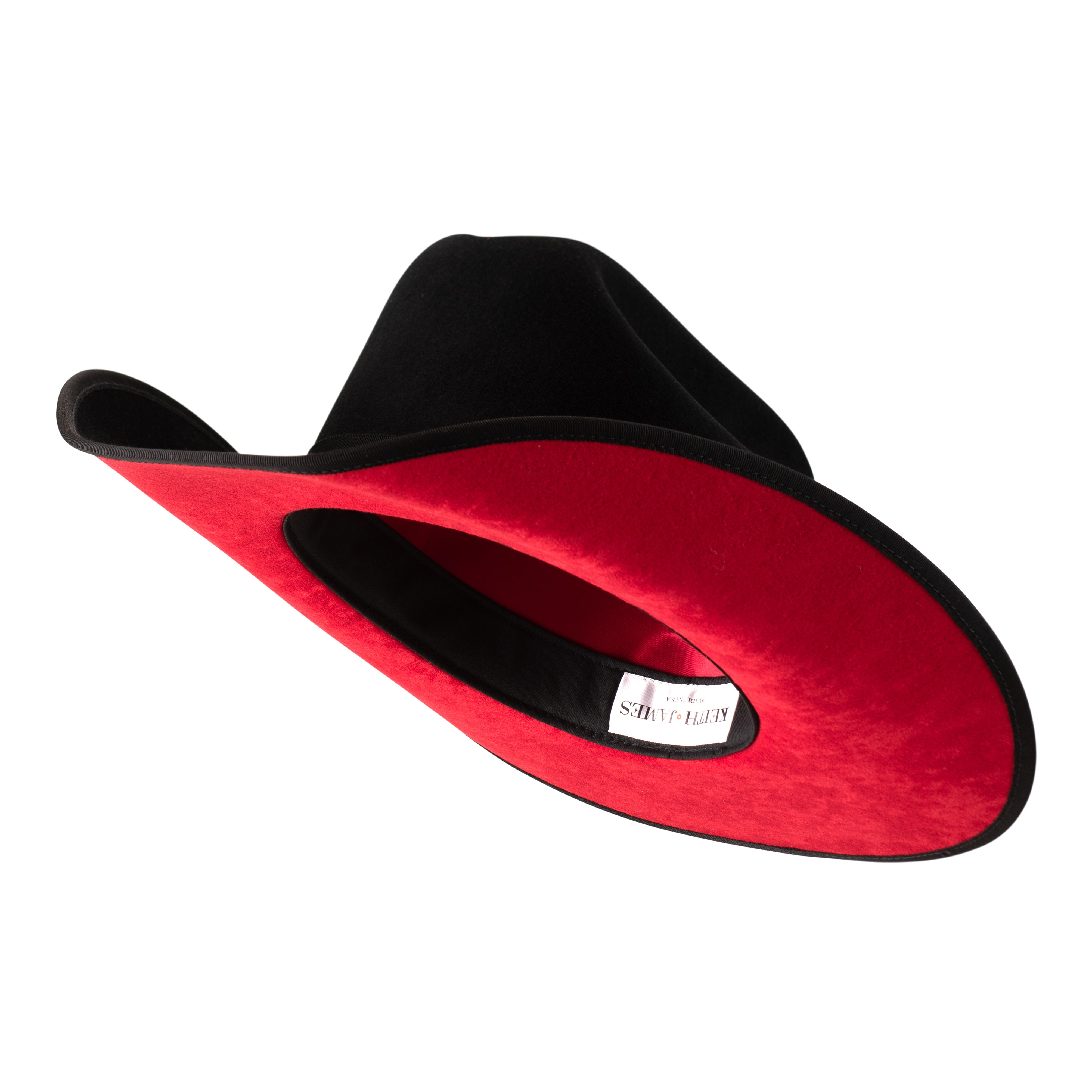 A black wool cowboy hat with a red sweatband, labeled with a brand logo pin.