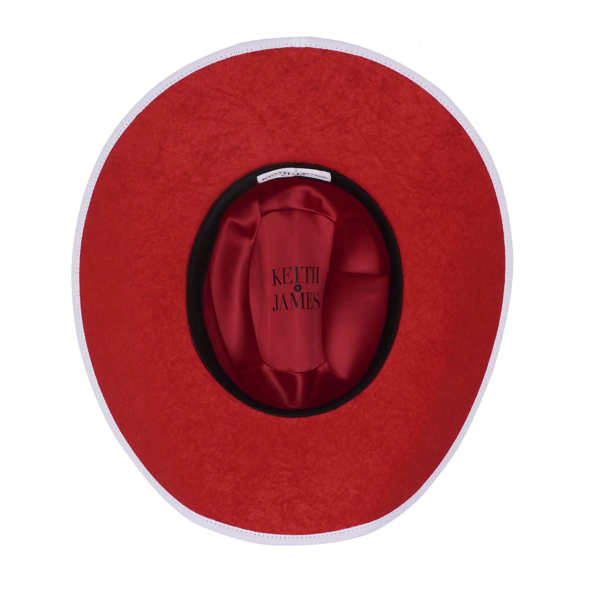 A white Western fedora with a red suede brim and a 'Keith And James' red circle logo pin.