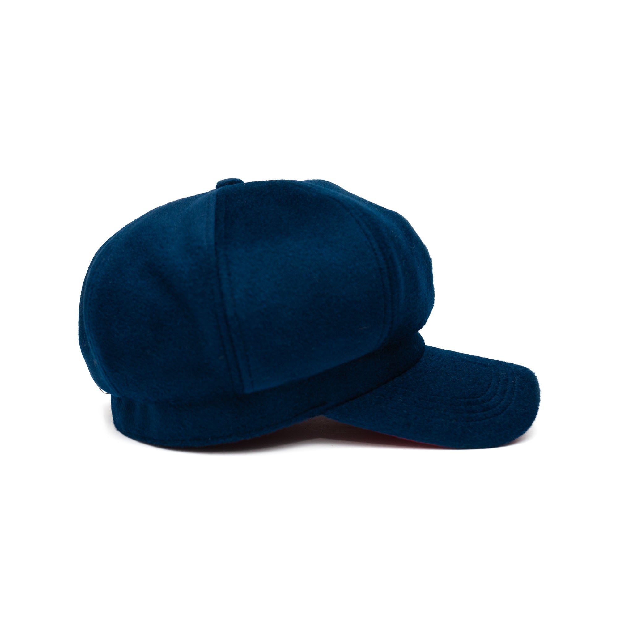 A sapphire blue colored hat made of wool with a satin lining and gold hardware.