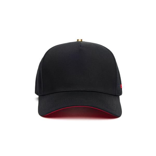 A black 5 panel baseball cap with an adjustable band and a red signature on the brim.