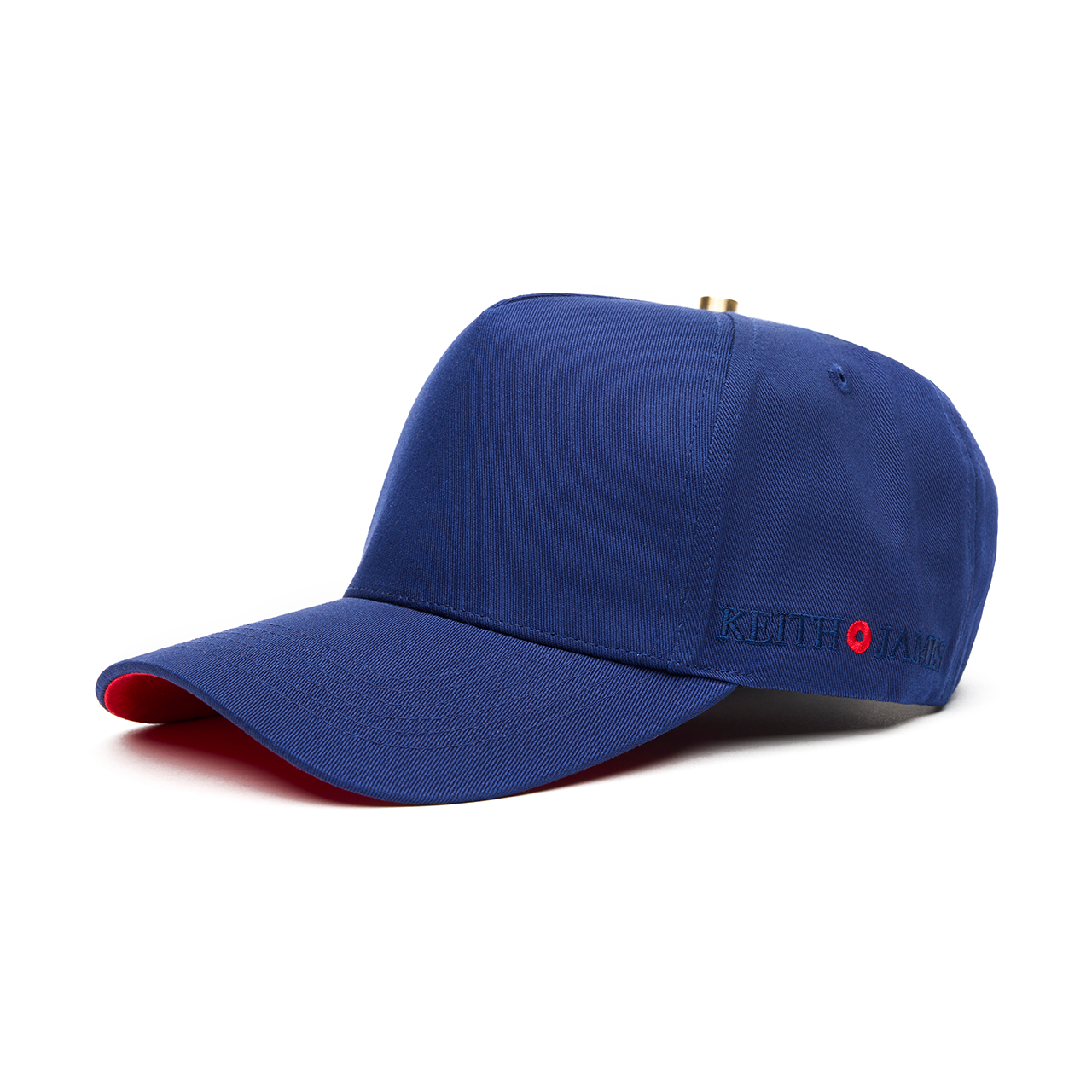 A navy blue 5 panel baseball cap with an adjustable band and a red bottom brim, featuring a logo embroidered on the front.