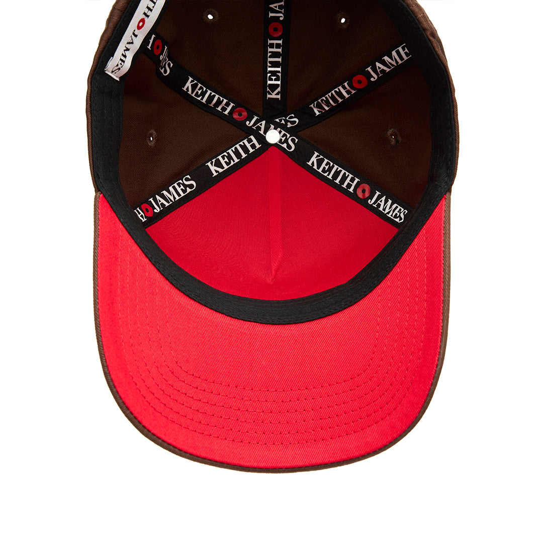 A brown 5 panel baseball cap with 'KEITH JAMES' embroidered in a circular logo on the front.