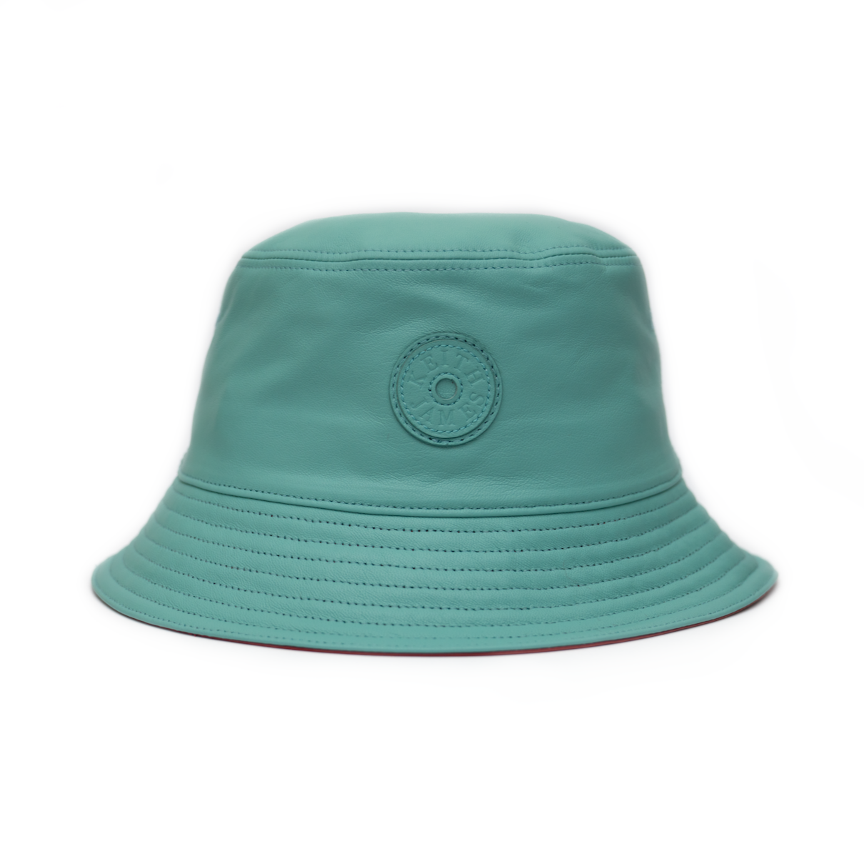 A blue leather bucket hat with a logo circle on the front.