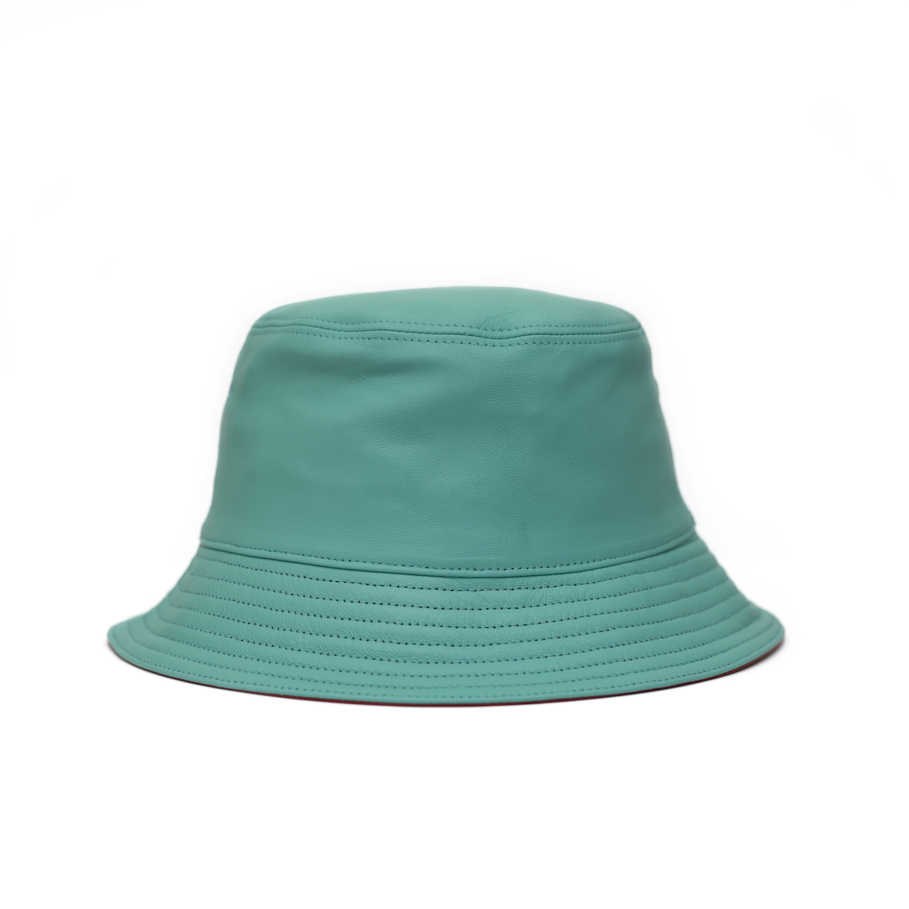 A blue leather bucket hat with a logo circle on the front.