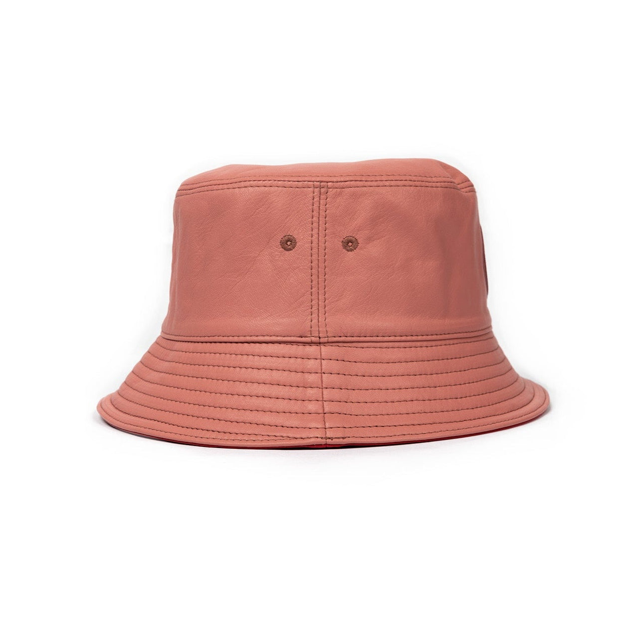 A plush pink leather bucket hat with a stamped leather logo circle on the front.