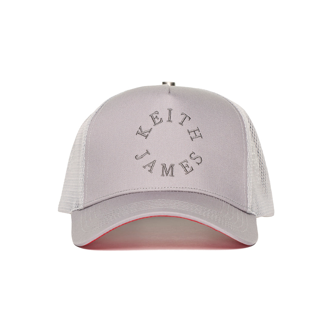 A trucker hat with a Keith James Logo
