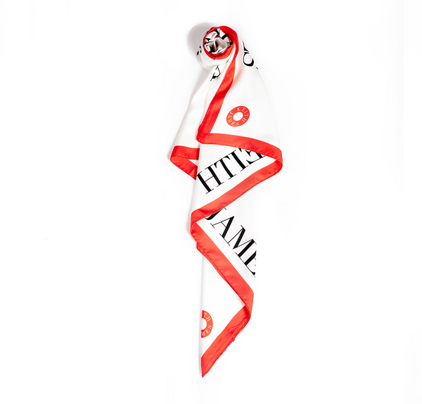 White scarf with red and black text on a white background