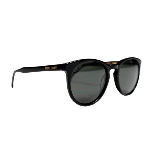 A pair of jet black sunglasses with dark grey polarized mineral glass lenses, featuring a keyhole bridge and engraved logo on the temple.