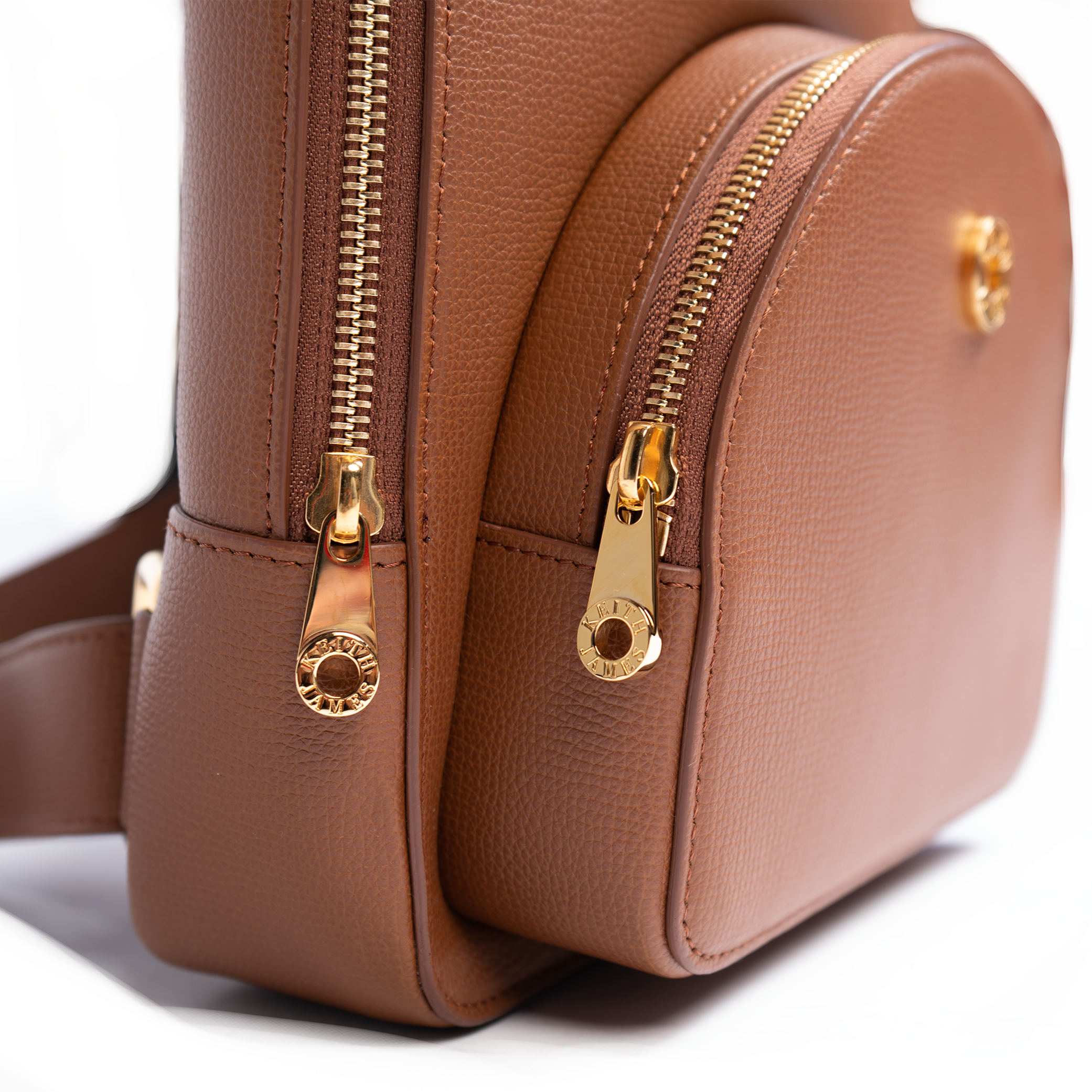 A cocoa brown backpack with a front zipper pocket and adjustable straps.