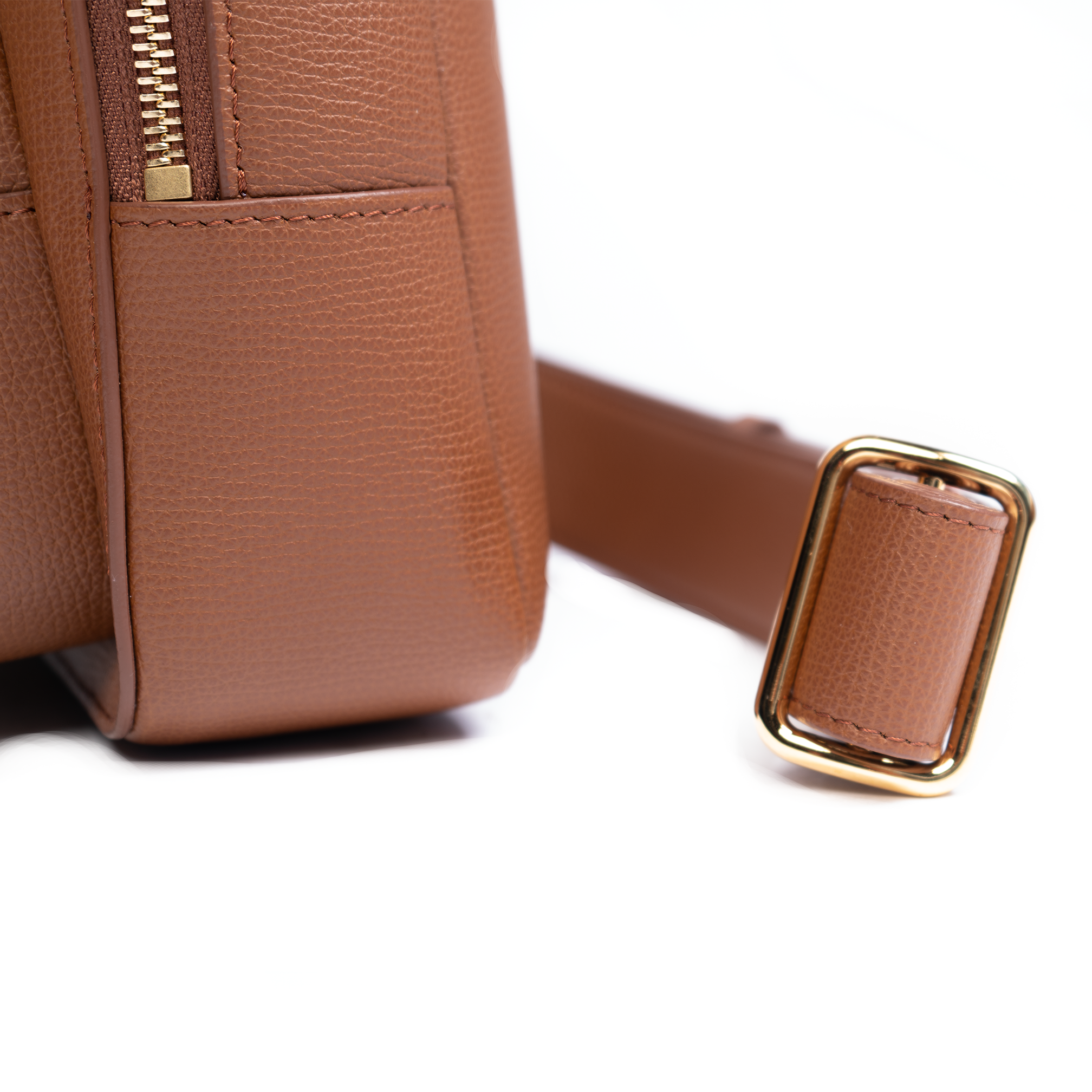 A cocoa brown backpack with a front zipper pocket and adjustable straps.