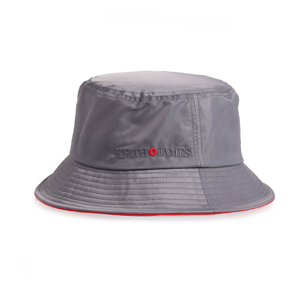 A cool grey bucket hat with a red band around the base, featuring a logo on the front.