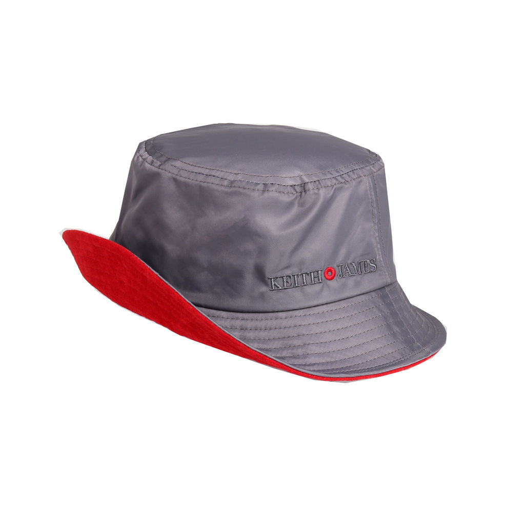 A cool grey bucket hat with a red band around the base, featuring a logo on the front.