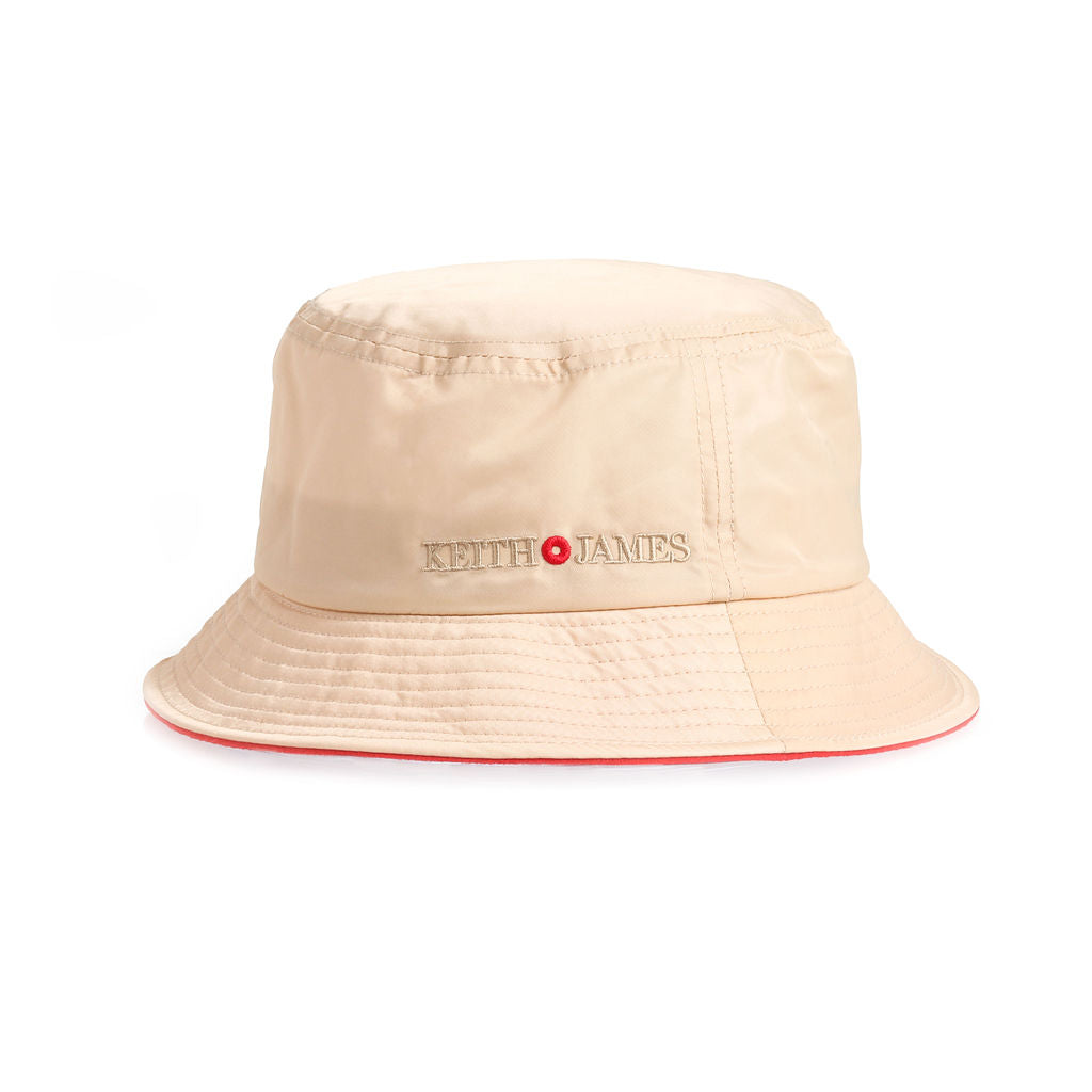 A beige bucket hat with the brand name 'KEITH JAMES' embroidered on the front.