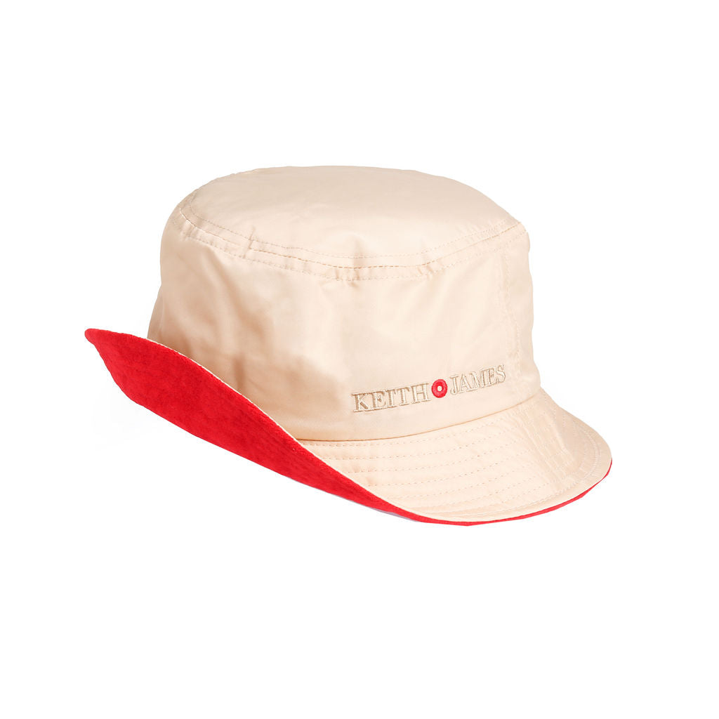 A beige bucket hat with the brand name 'KEITH JAMES' embroidered on the front.