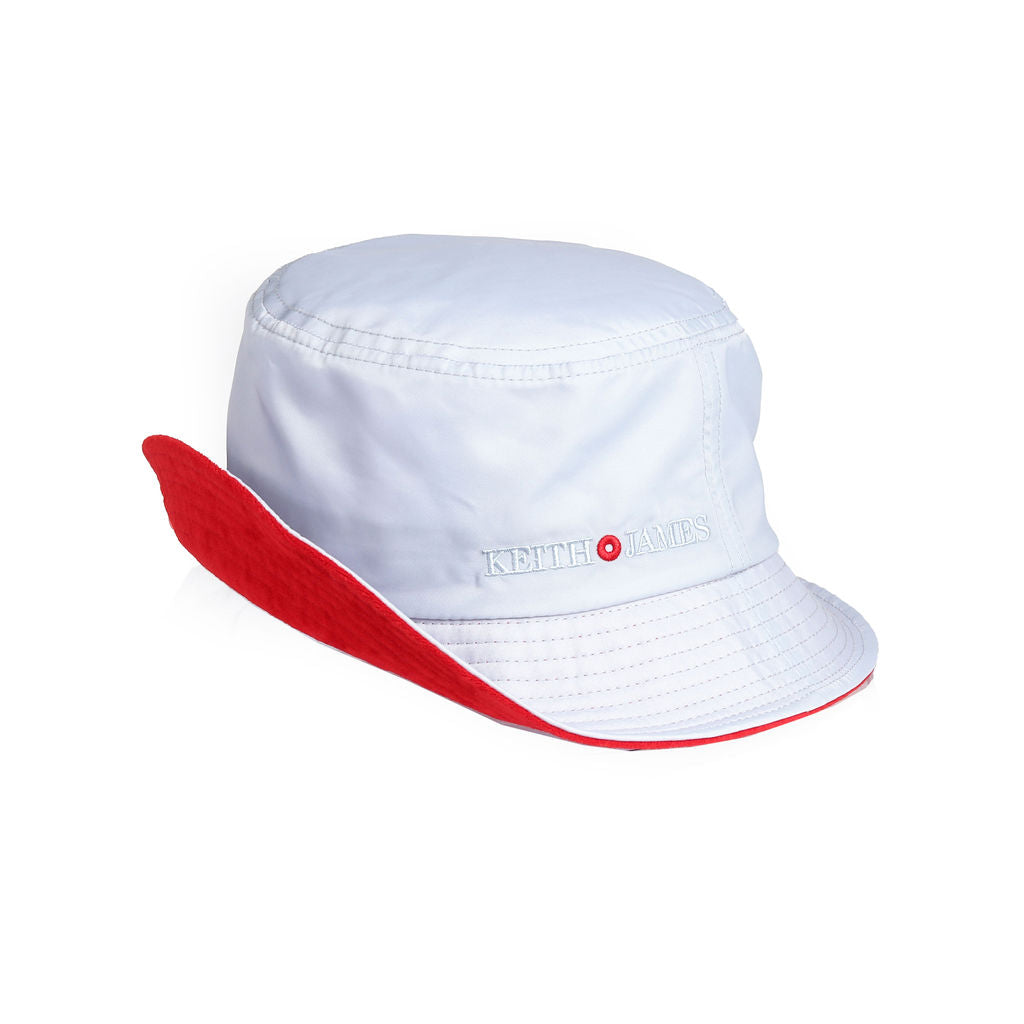 A silver blue bucket hat with a red inner brim, featuring a brand logo on the front.