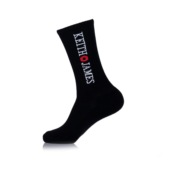 A black crew-length sock with text 'KEITH JAMES' printed on the side.