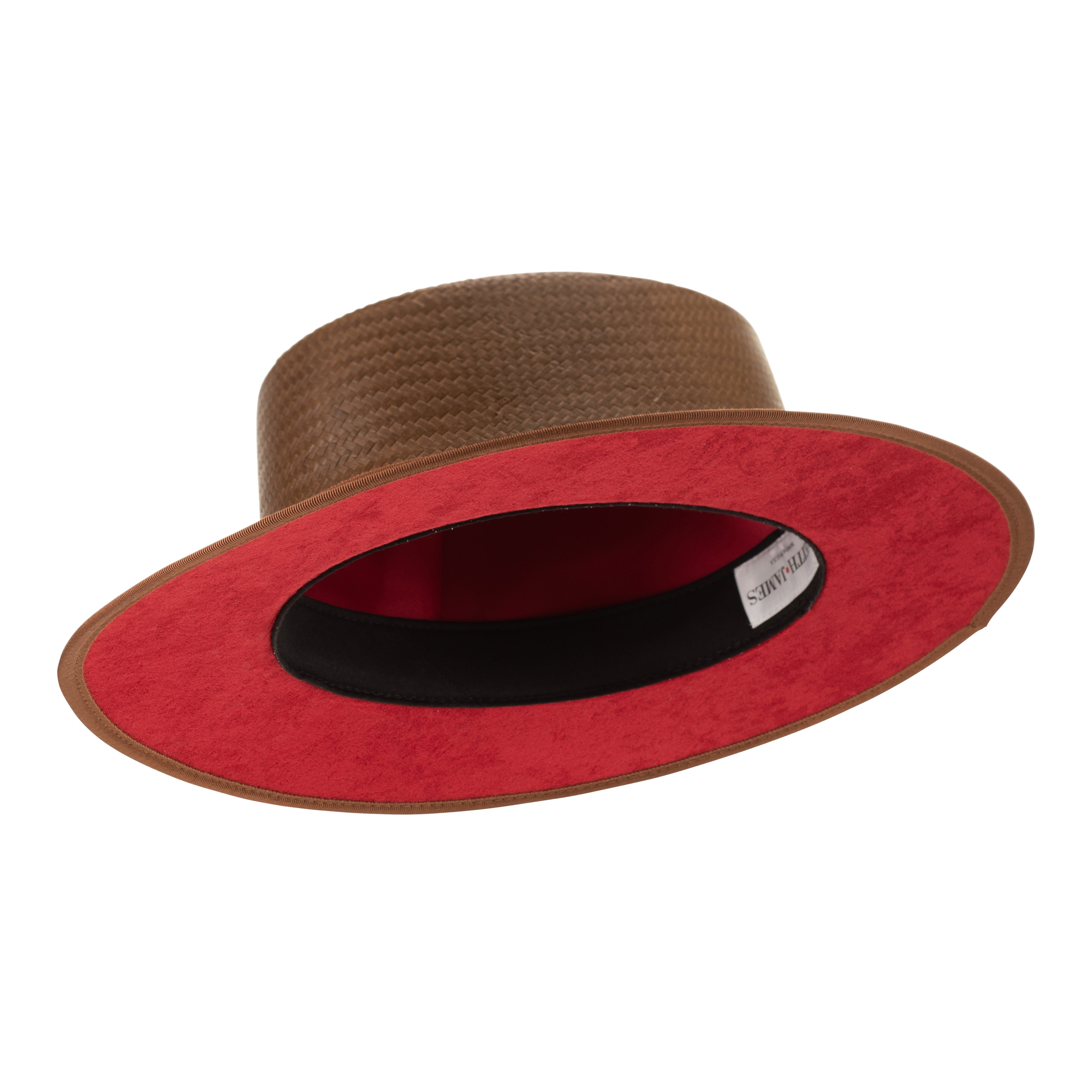 Brown straw hat with a leather band and red button on a white background