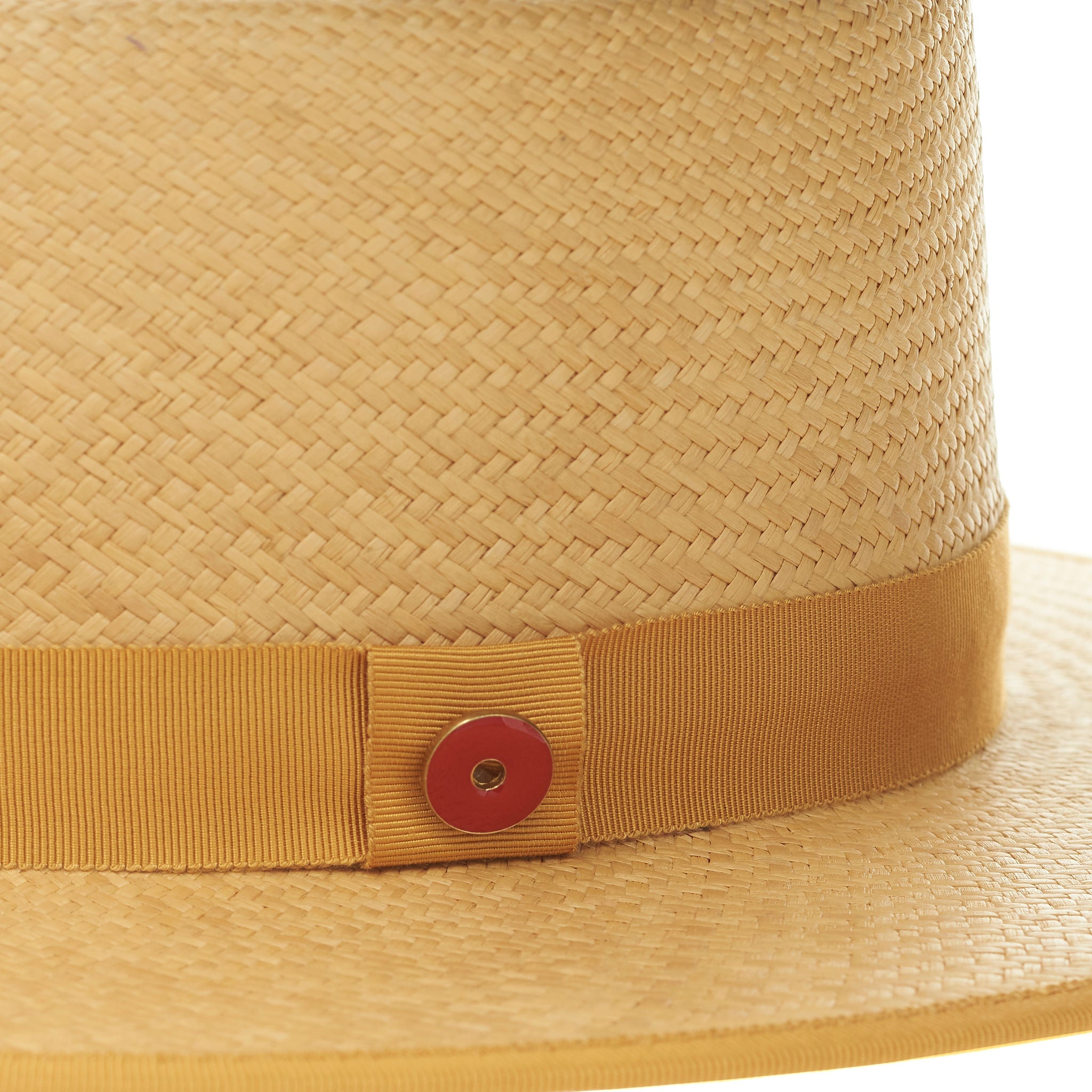 Beige straw hat with a brown band on a white background