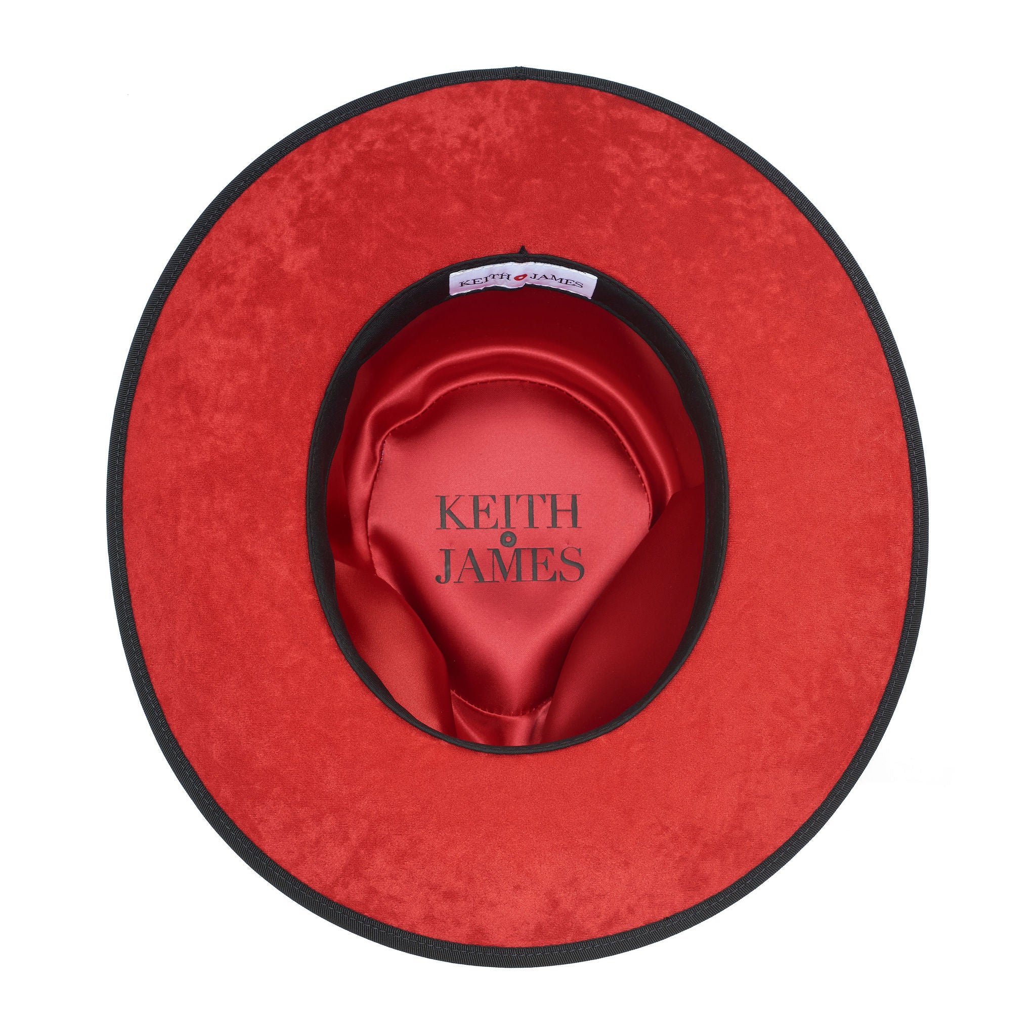 A classic black hat with a red bottom brim and a signature logo pin on the side.