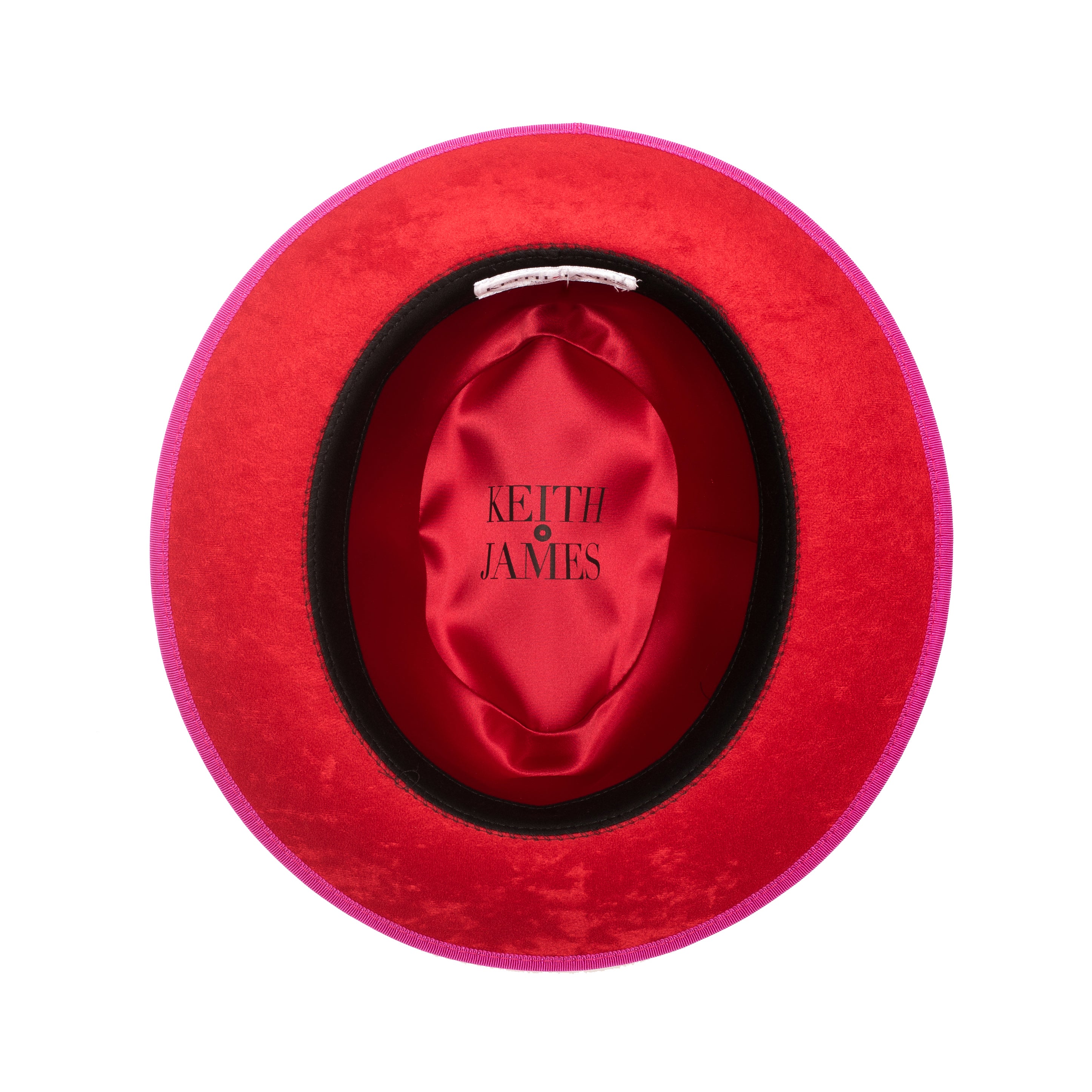 A hot pink classic center-creased fedora with a 2.5 inch curved brim and a signature logo pin on the side.