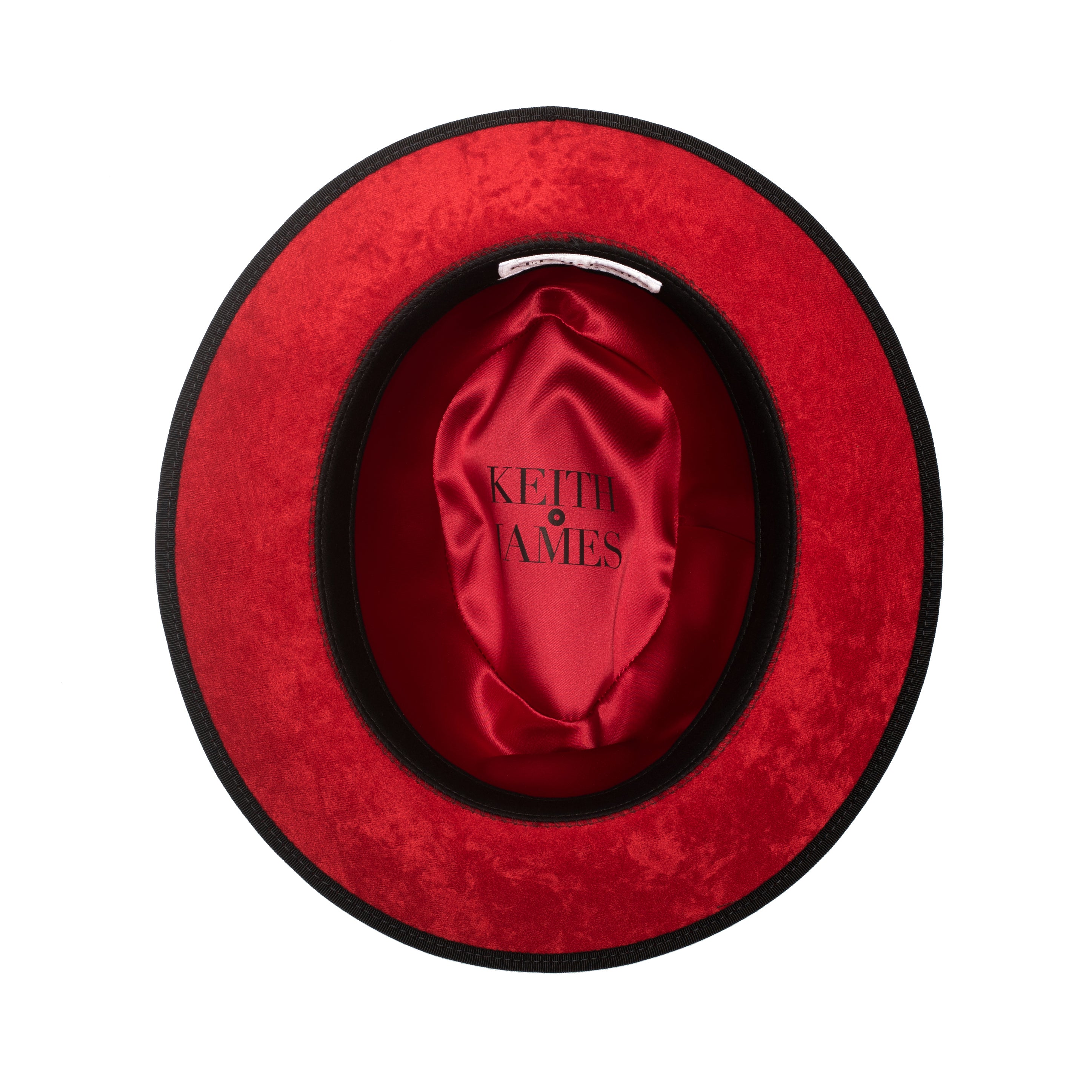 A classic black fedora hat with a red band and a signature logo pin.