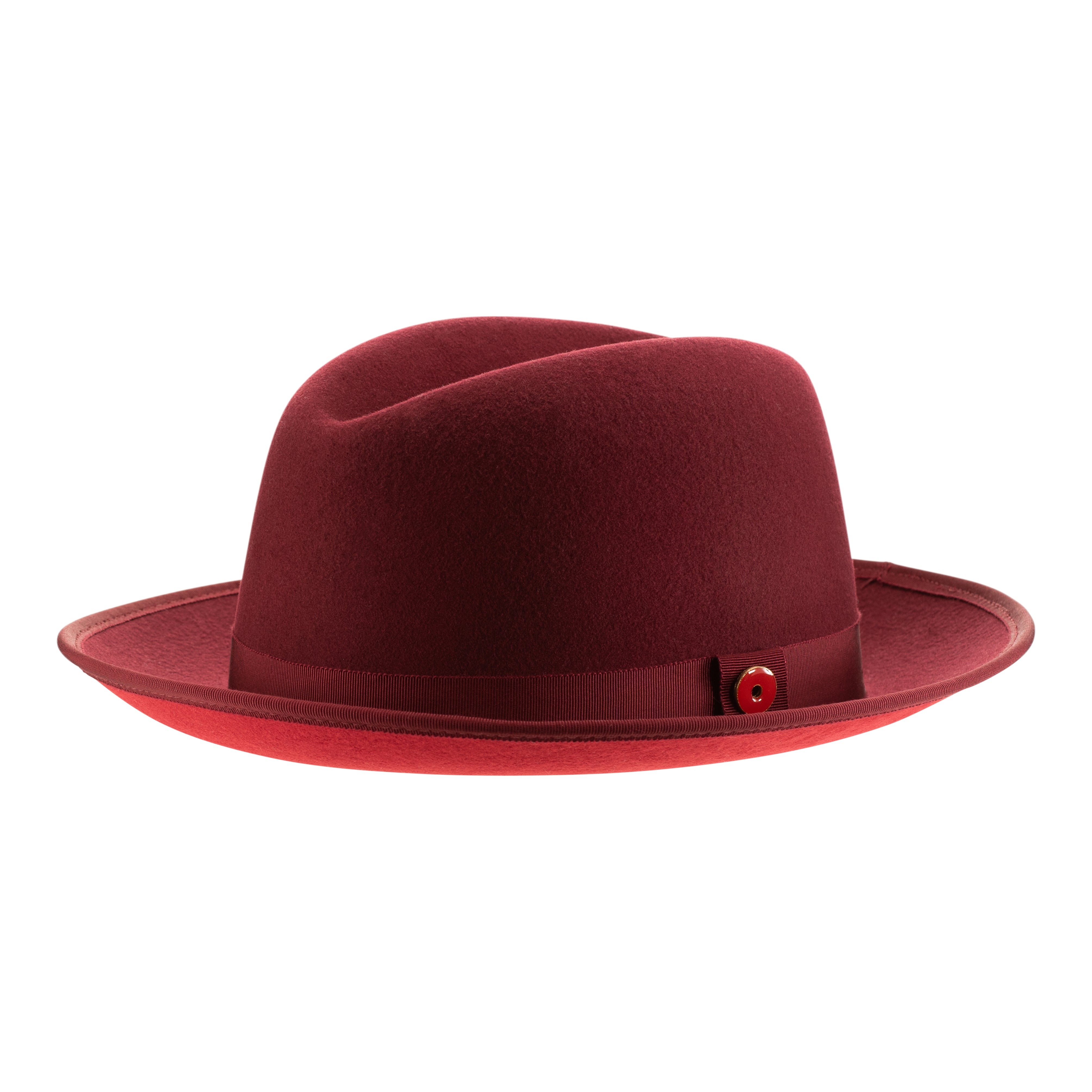 A classic center-creased fedora hat in old maroon color with a 2.5 inch curved brim, classic ribbon trim, a signature logo pin, and a red bottom brim.